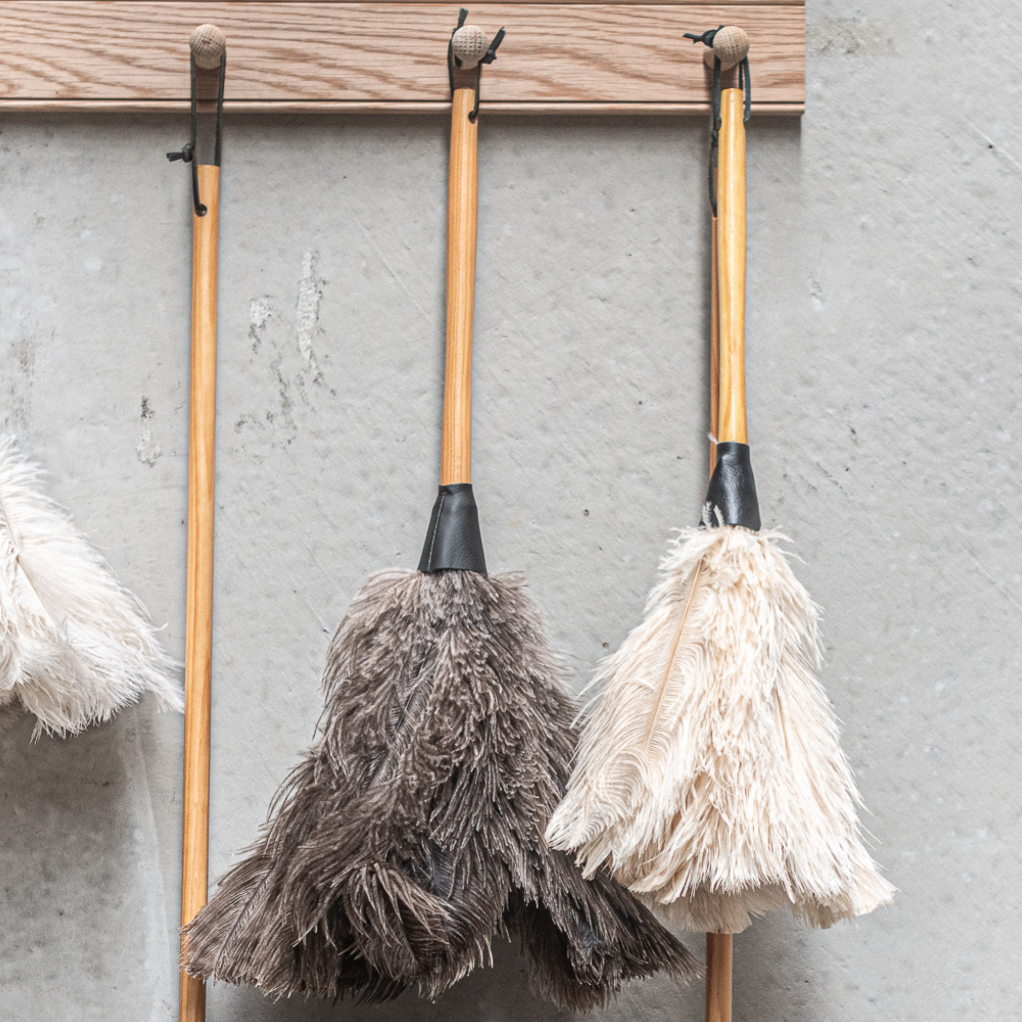 South African-made ostrich feather duster by Heaven in Earth (HIE), featuring soft, natural ostrich feathers that attract dust without spreading it. The lightweight wooden handle makes it easy to use, offering an elegant, eco-friendly solution for gentle, effective cleaning