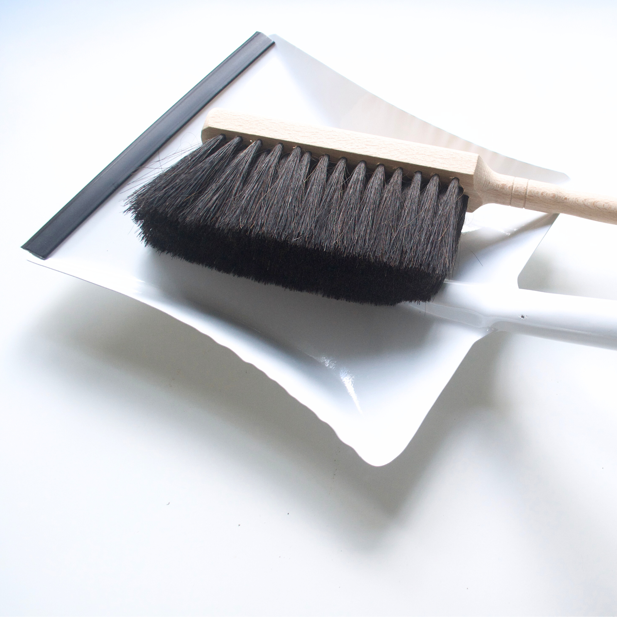 Heaven in Earth (HIE) German-made metal dustpan, available in black or white, featuring a sleek, durable design with a comfortable handle, perfect for quick and efficient cleanup while adding a modern, minimalist touch to your cleaning tools