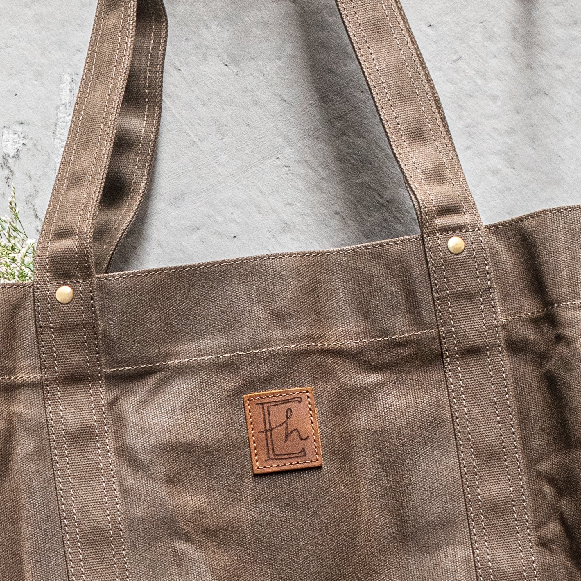 Durable Waxed Canvas Carry All by Heaven in Earth, designed for everyday use with a rugged, water-resistant waxed canvas construction. This versatile bag features sturdy handles and a spacious interior, perfect for carrying everything from groceries to gym gear, offering both style and practicality for on-the-go living.