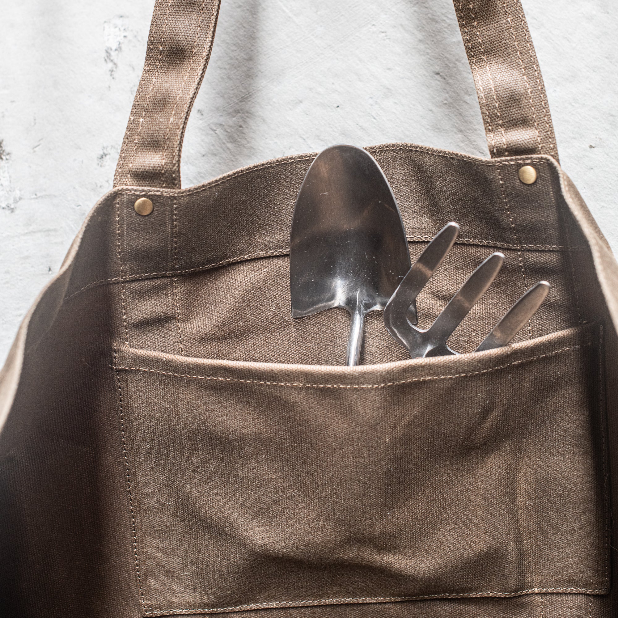 Durable Waxed Canvas Carry All by Heaven in Earth, designed for everyday use with a rugged, water-resistant waxed canvas construction. This versatile bag features sturdy handles and a spacious interior, perfect for carrying everything from groceries to gym gear, offering both style and practicality for on-the-go living.