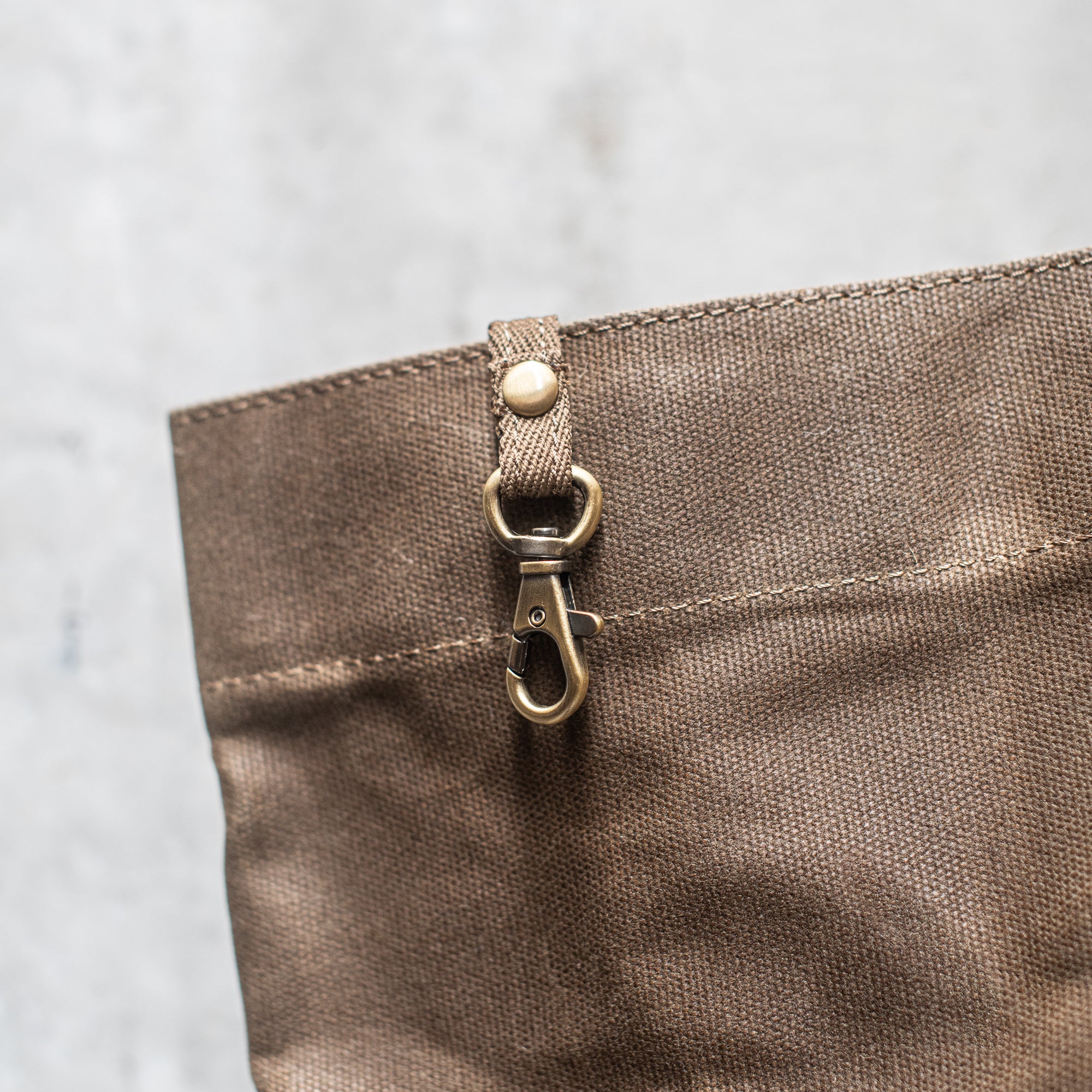 Durable Waxed Canvas Carry All by Heaven in Earth, designed for everyday use with a rugged, water-resistant waxed canvas construction. This versatile bag features sturdy handles and a spacious interior, perfect for carrying everything from groceries to gym gear, offering both style and practicality for on-the-go living.