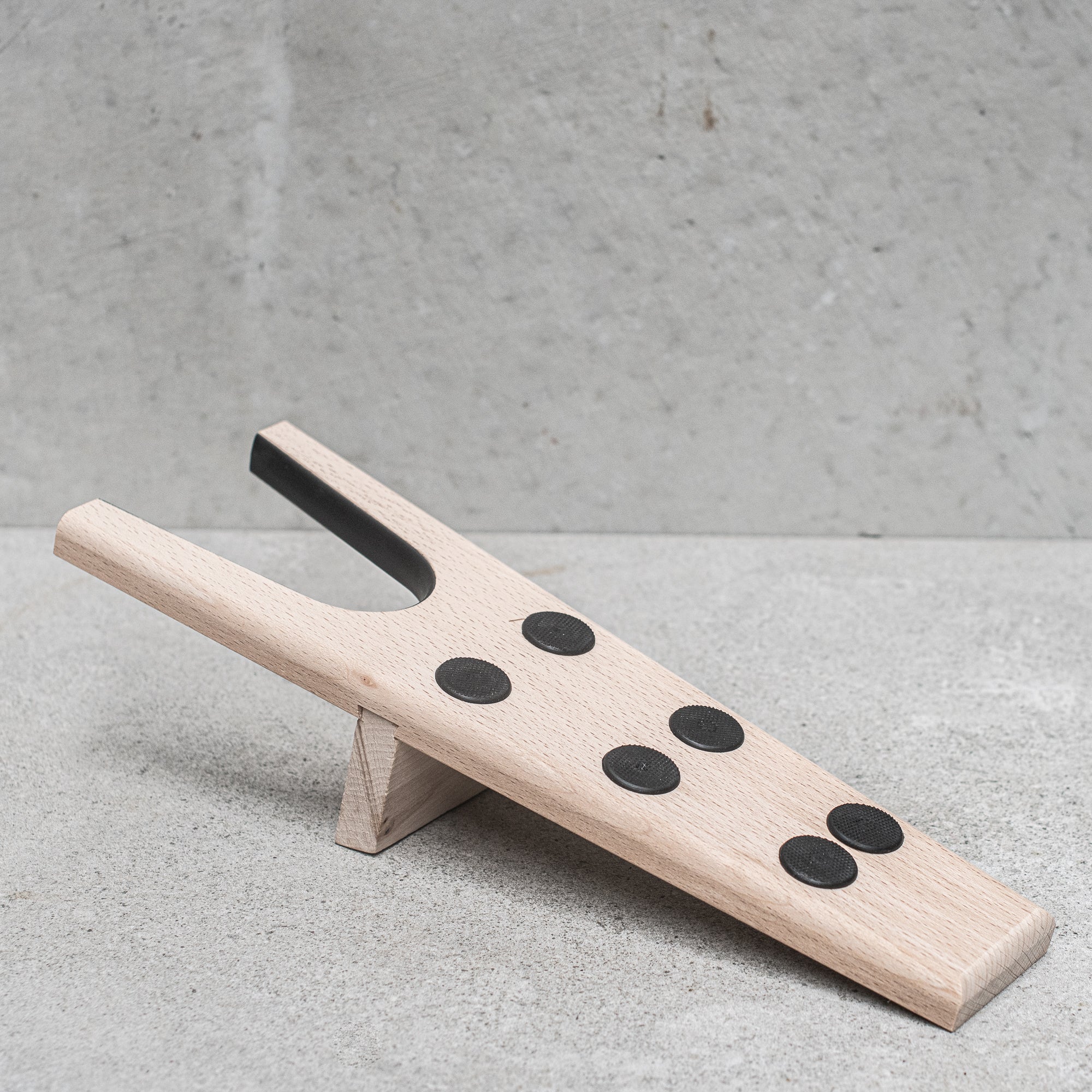 German-made FSC-certified wooden bootjack, crafted from high-quality, sustainably sourced beechwood, designed for easy and efficient removal of boots with a sturdy, ergonomic design