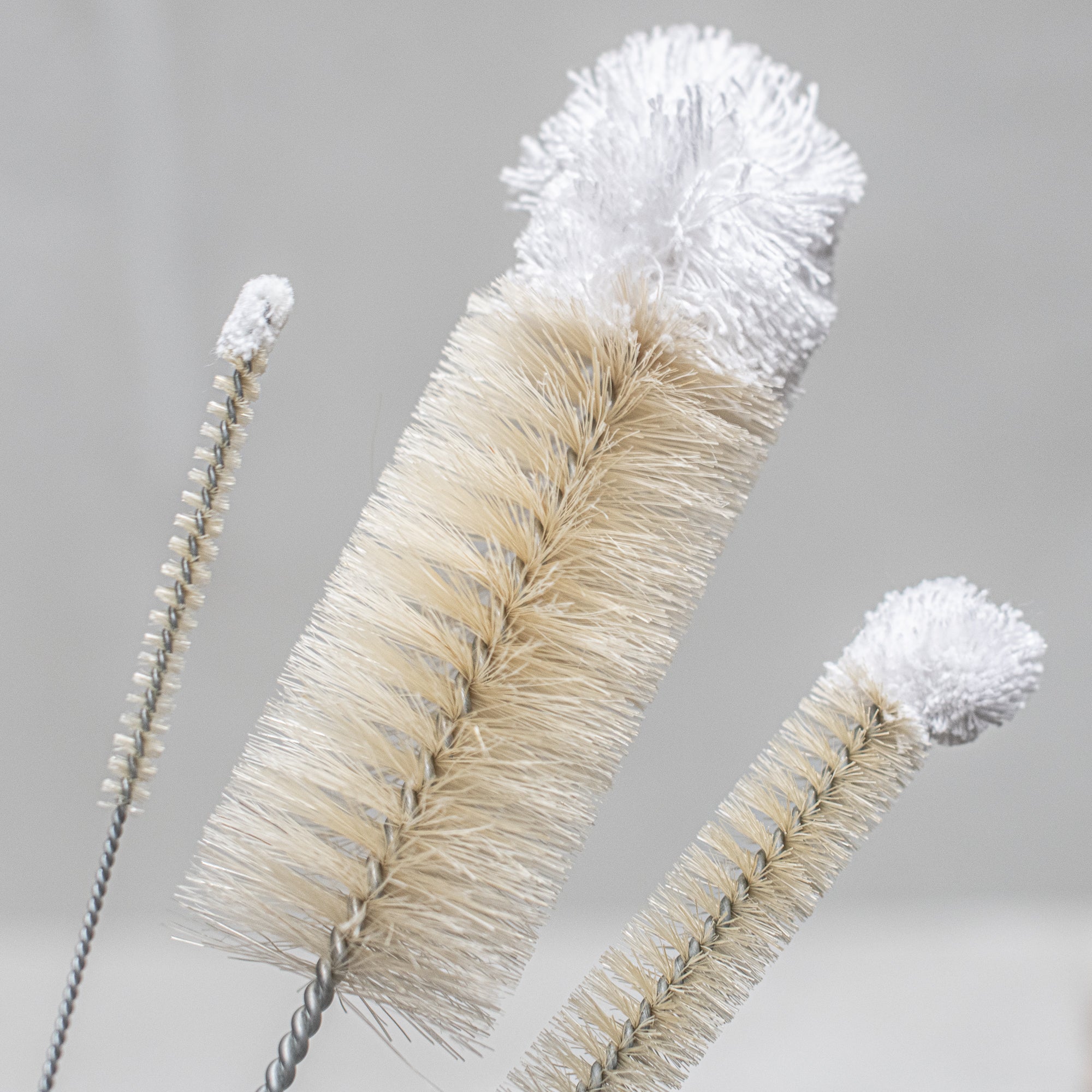 German-made natural cotton wool top bottle brush, featuring soft, gentle cotton fibres and a durable handle, ideal for cleaning delicate bottles and containers without scratching. 3 sizes