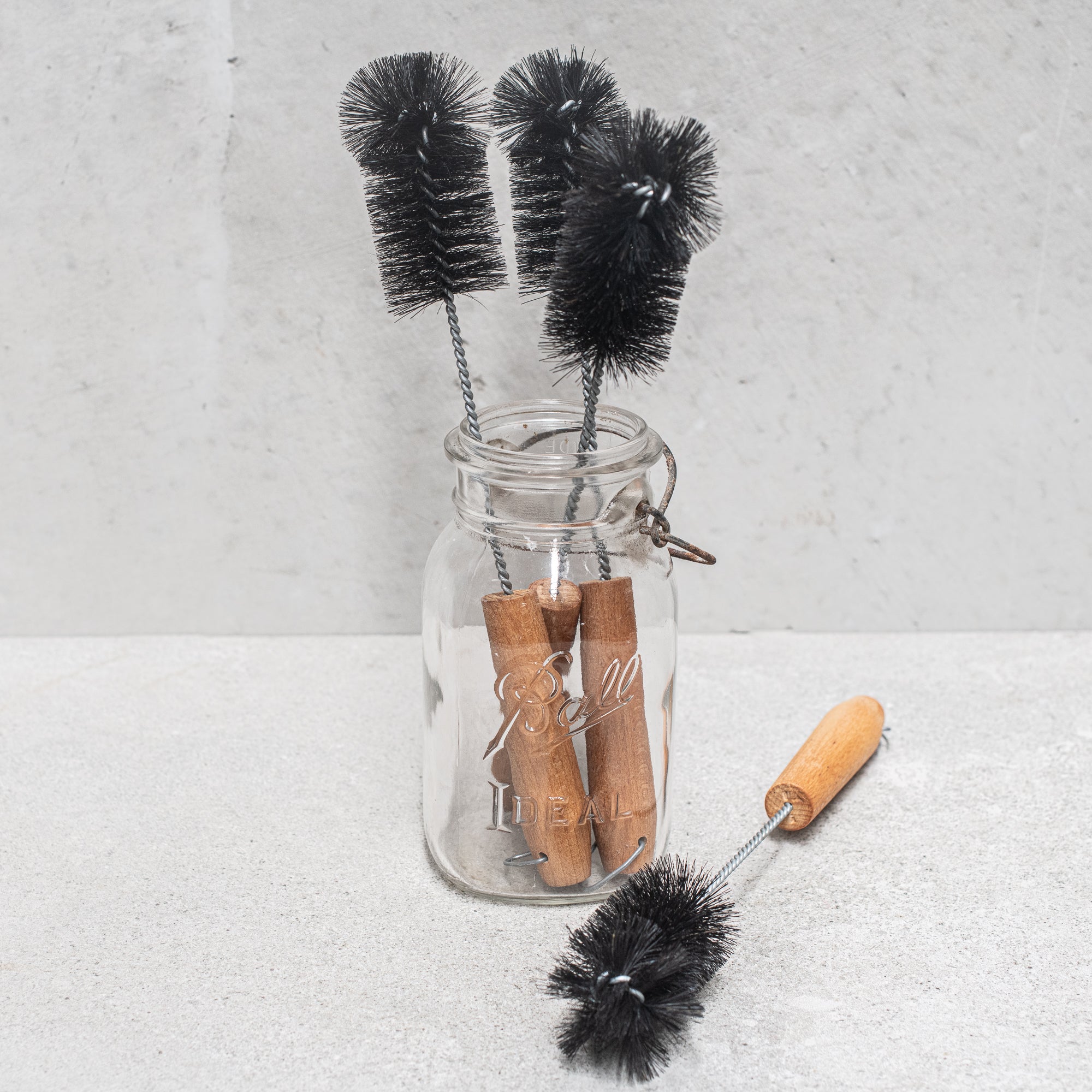 German-made bottle brush with natural fibre bristles light and dark, and a sturdy wooden handle, designed for thorough cleaning of bottles and jars, offering durability and eco-friendly craftsmanship