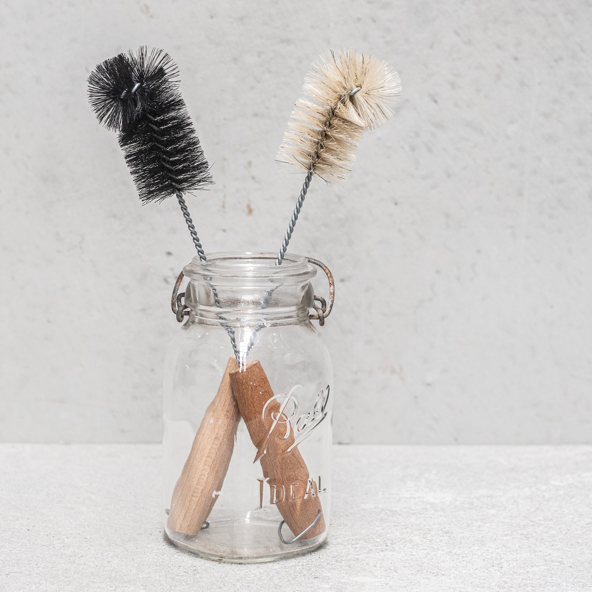 German-made bottle brush with natural fibre bristles light and dark, and a sturdy wooden handle, designed for thorough cleaning of bottles and jars, offering durability and eco-friendly craftsmanship