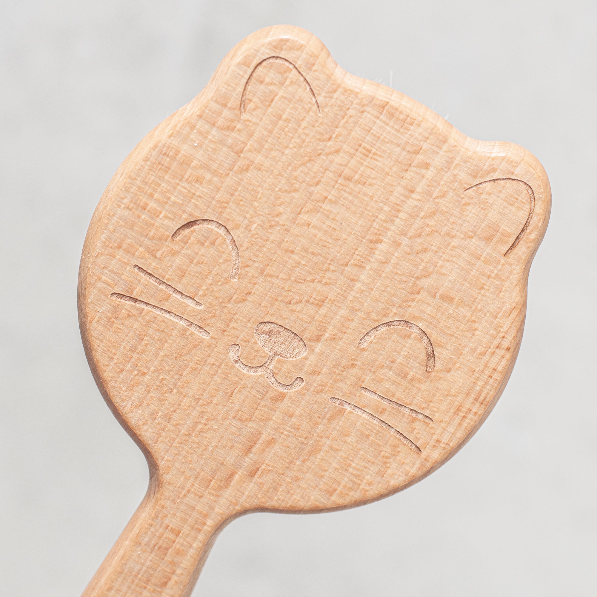 baby hair brush with beechwood handle and engraved cat design