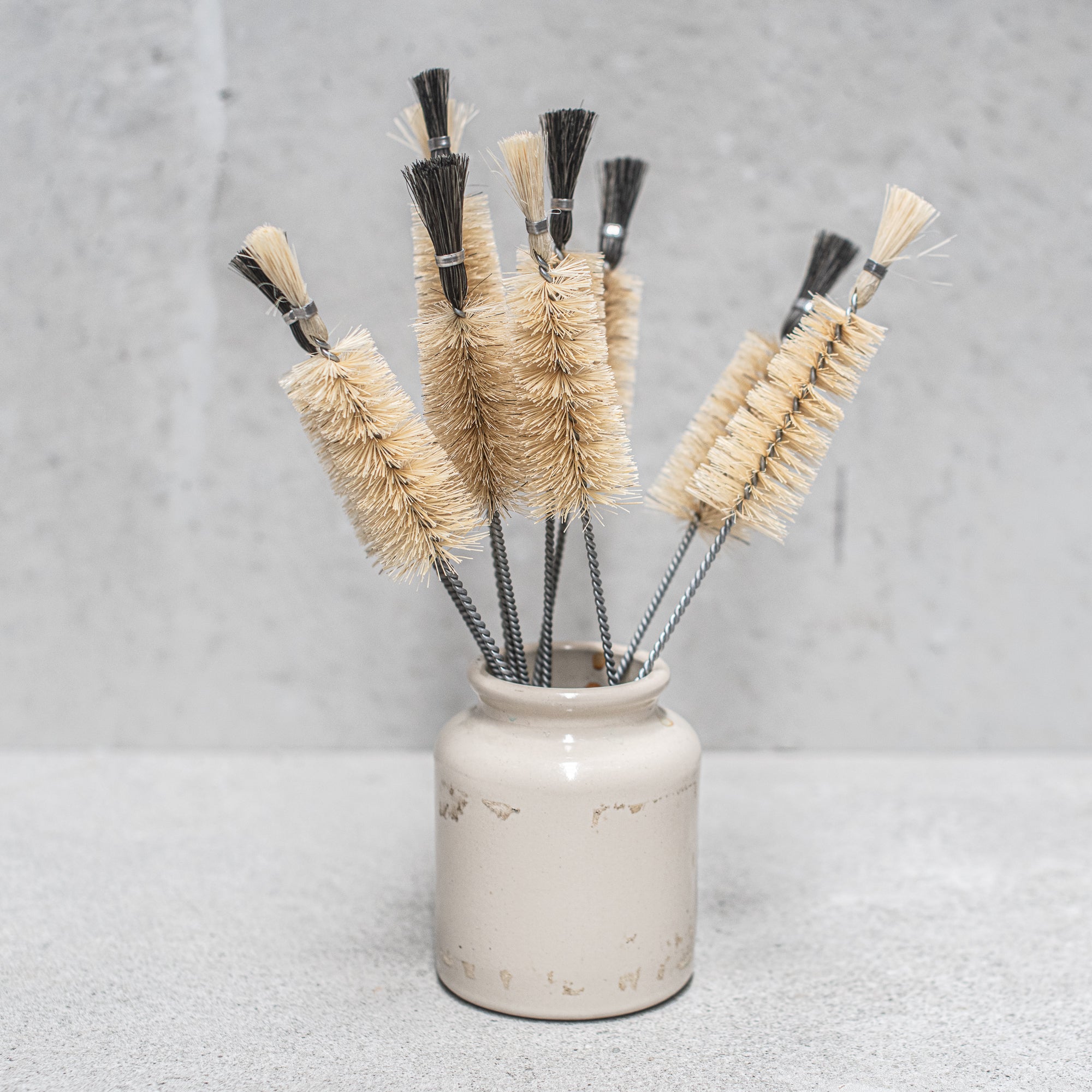 German made Vegan conical bottle brush with Tampico fibre bristles, designed for effective cleaning of bottles and narrow containers, featuring a sustainable wooden handle
