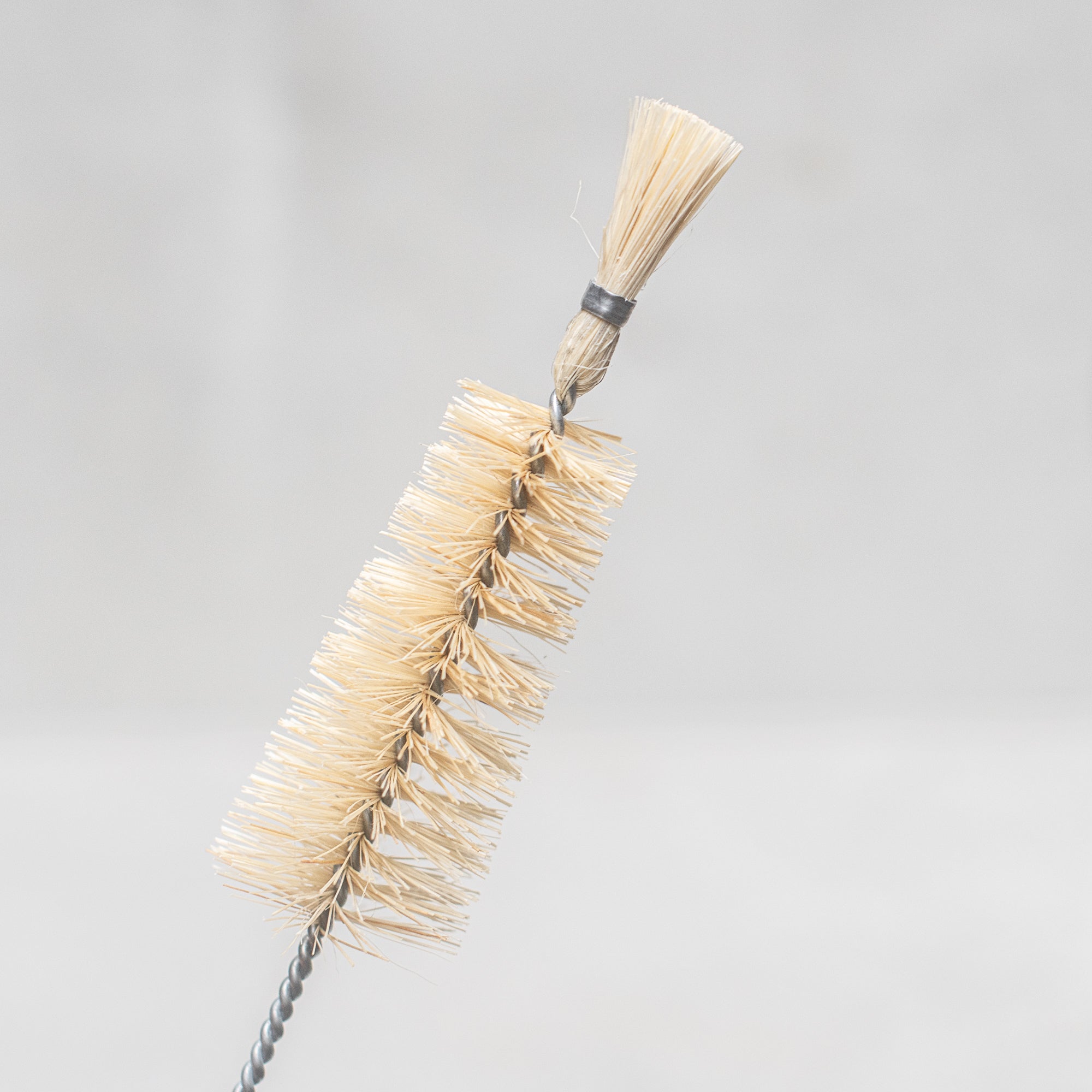 German made Vegan conical bottle brush with Tampico fibre bristles, designed for effective cleaning of bottles and narrow containers, featuring a sustainable wooden handle