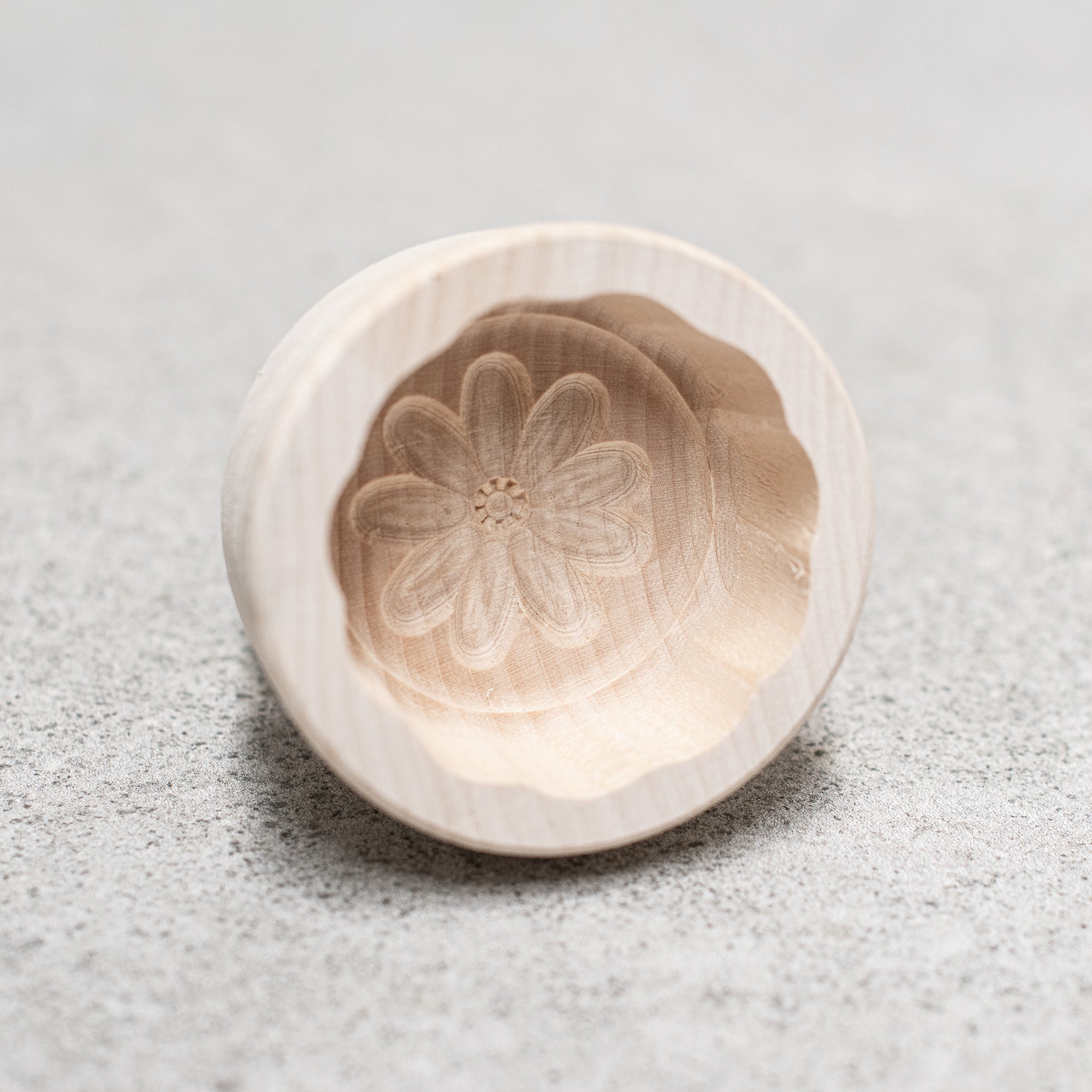 German-made wooden butter making pats and moulds, crafted from high-quality wood with intricate designs, perfect for shaping and pressing homemade butter with traditional craftsmanship."