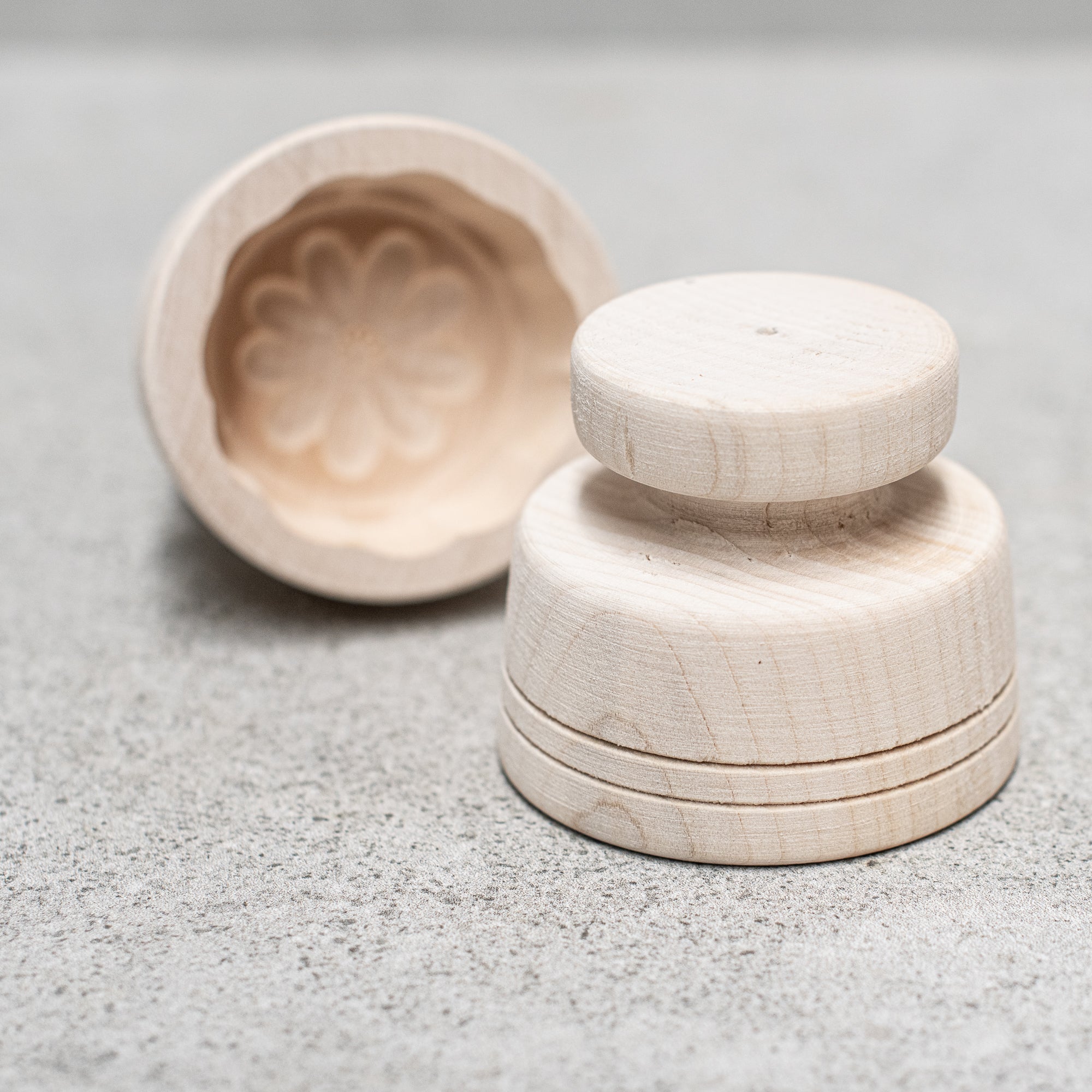 German-made wooden butter making pats and moulds, crafted from high-quality wood with intricate designs, perfect for shaping and pressing homemade butter with traditional craftsmanship."