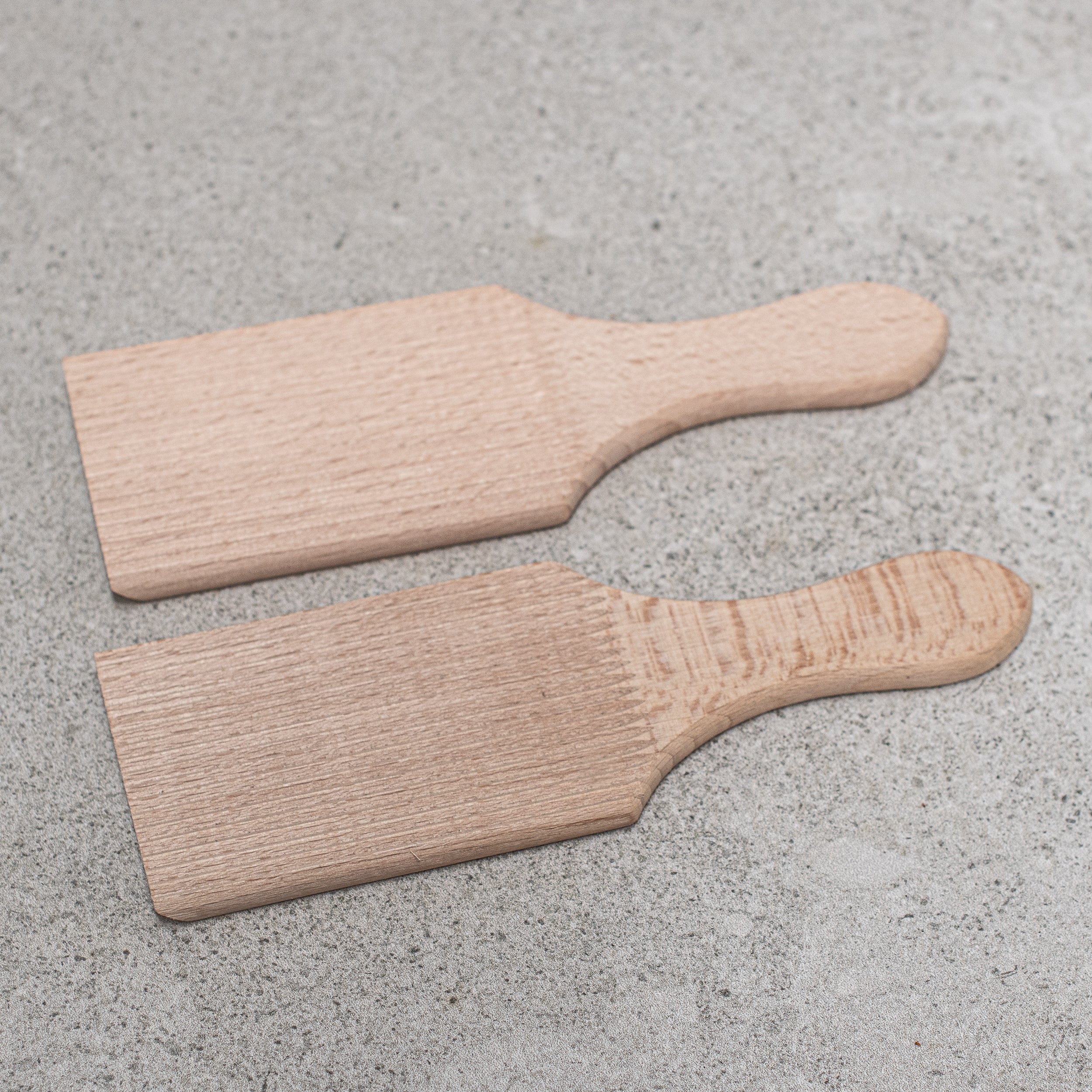 German-made wooden butter making pats and moulds, crafted from high-quality wood with intricate designs, perfect for shaping and pressing homemade butter with traditional craftsmanship."