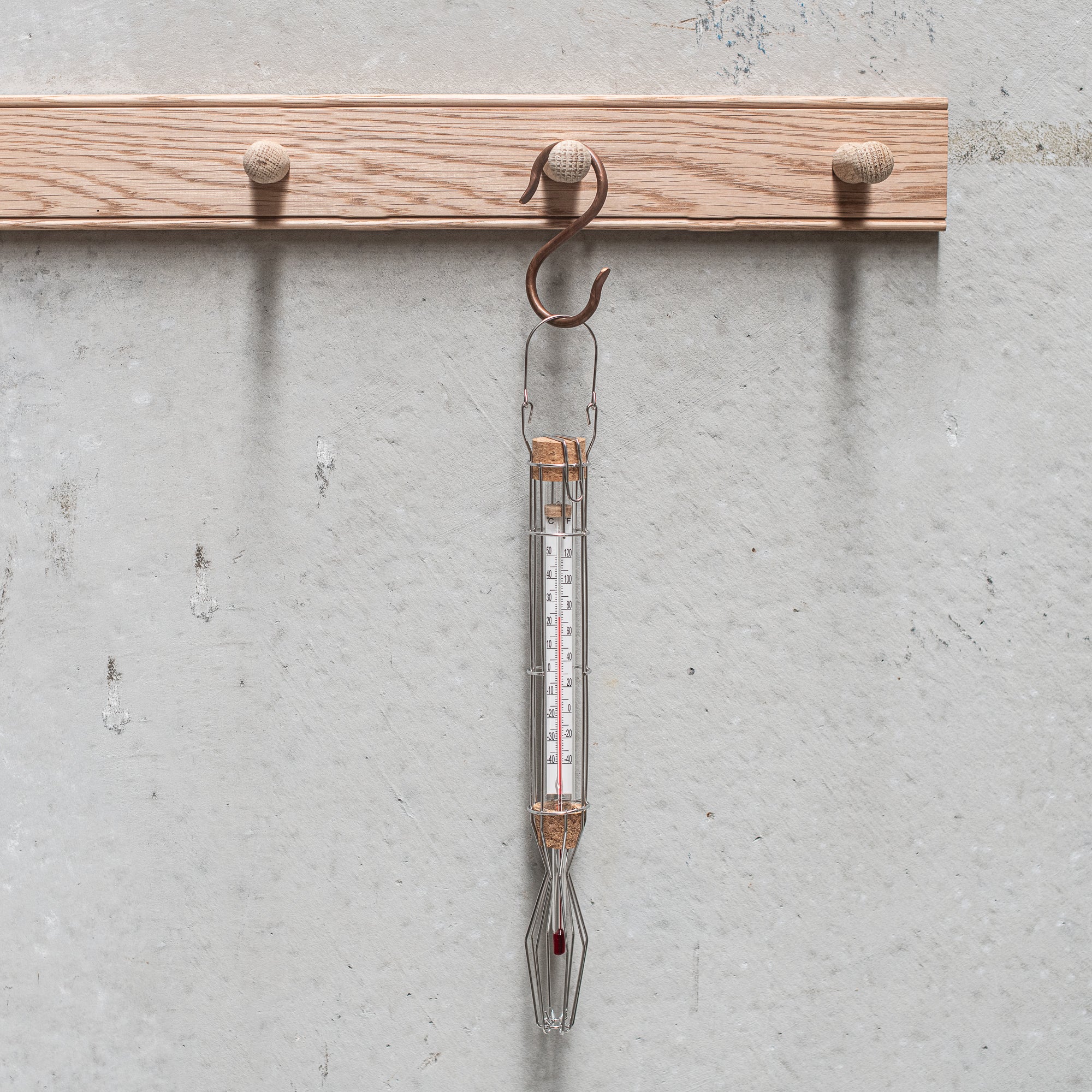 Stainless steel cage weather thermometer, featuring a sleek design with durable metal housing, ideal for measuring outdoor temperatures with accuracy and style.