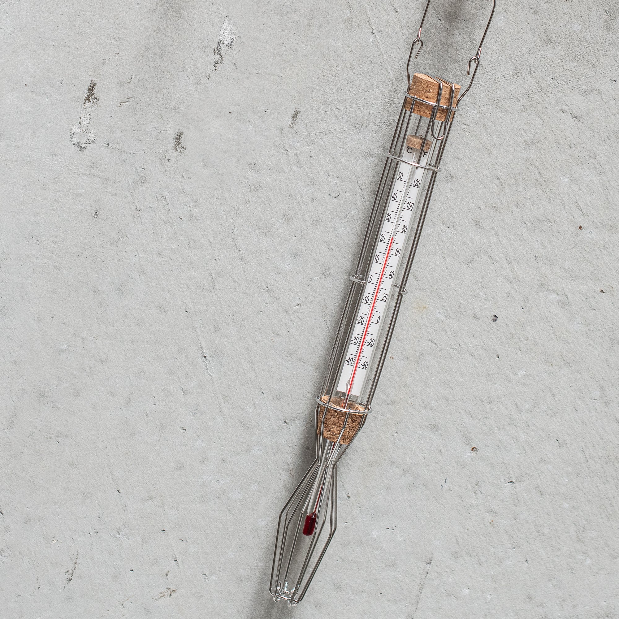 Stainless steel cage weather thermometer, featuring a sleek design with durable metal housing, ideal for measuring outdoor temperatures with accuracy and style.
