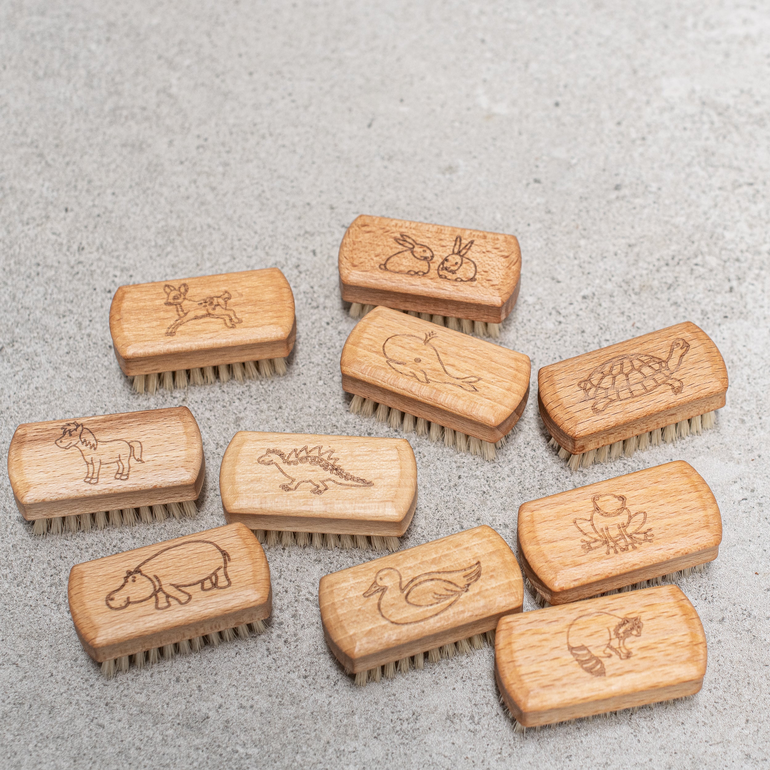 Natural German children's nail brush, crafted with soft, gentle bristles and a smooth wooden handle, perfect for cleaning little nails with care and comfort.