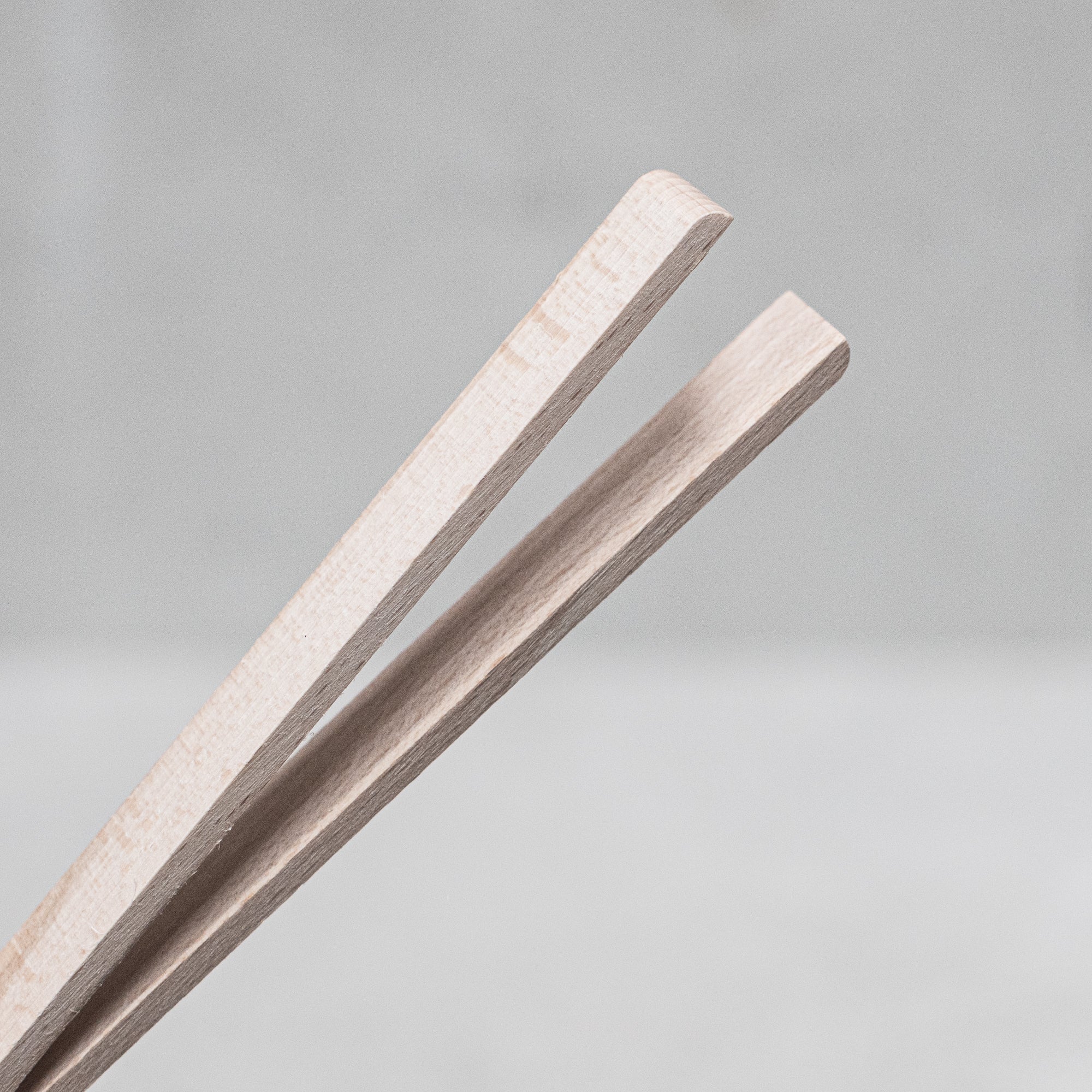 Children's wooden German-made cookset, crafted from durable, natural wood, featuring miniature kitchen tools like a spoon, whisk and tongs, designed for imaginative play and budding chefs.