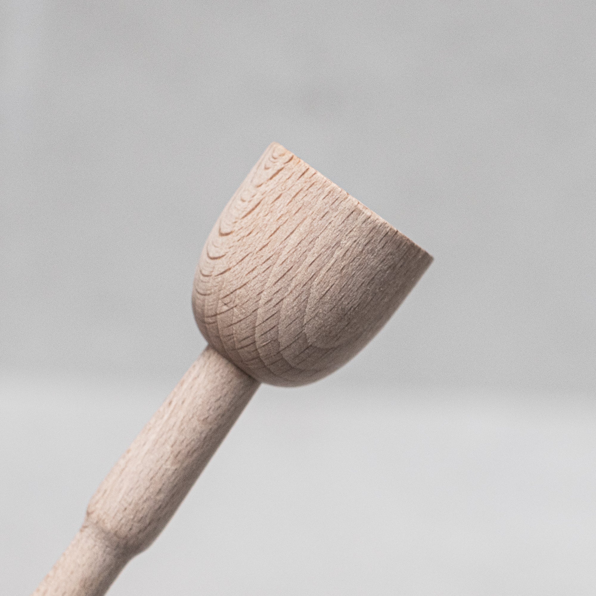 Children's wooden German-made cookset, crafted from durable, natural wood, featuring miniature kitchen tools like a spoon, whisk and tongs, designed for imaginative play and budding chefs.