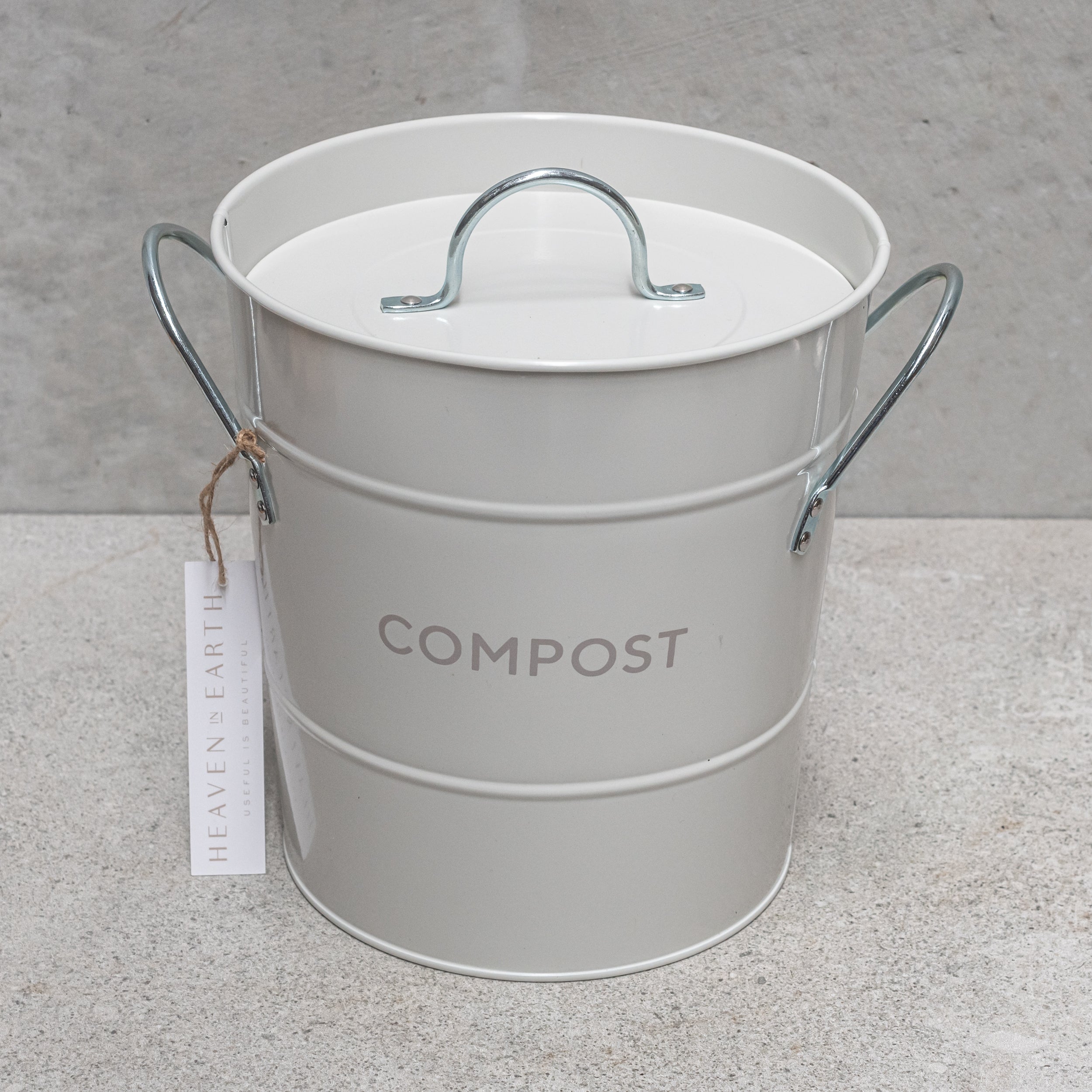 Heaven in Earth metal compost bin, featuring a sleek, durable design perfect for collecting kitchen scraps and creating nutrient-rich compost.