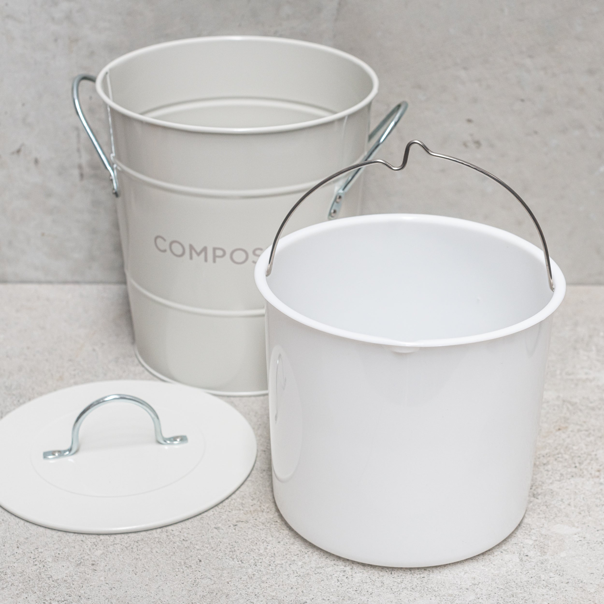 Heaven in Earth metal compost bin, featuring a sleek, durable design perfect for collecting kitchen scraps and creating nutrient-rich compost.
