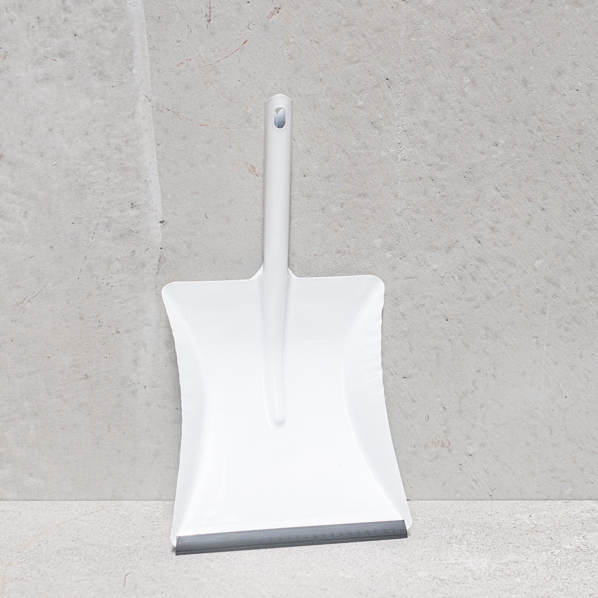 Heaven in Earth (HIE) German-made metal dustpan, available in black or white, featuring a sleek, durable design with a comfortable handle, perfect for quick and efficient cleanup while adding a modern, minimalist touch to your cleaning tools