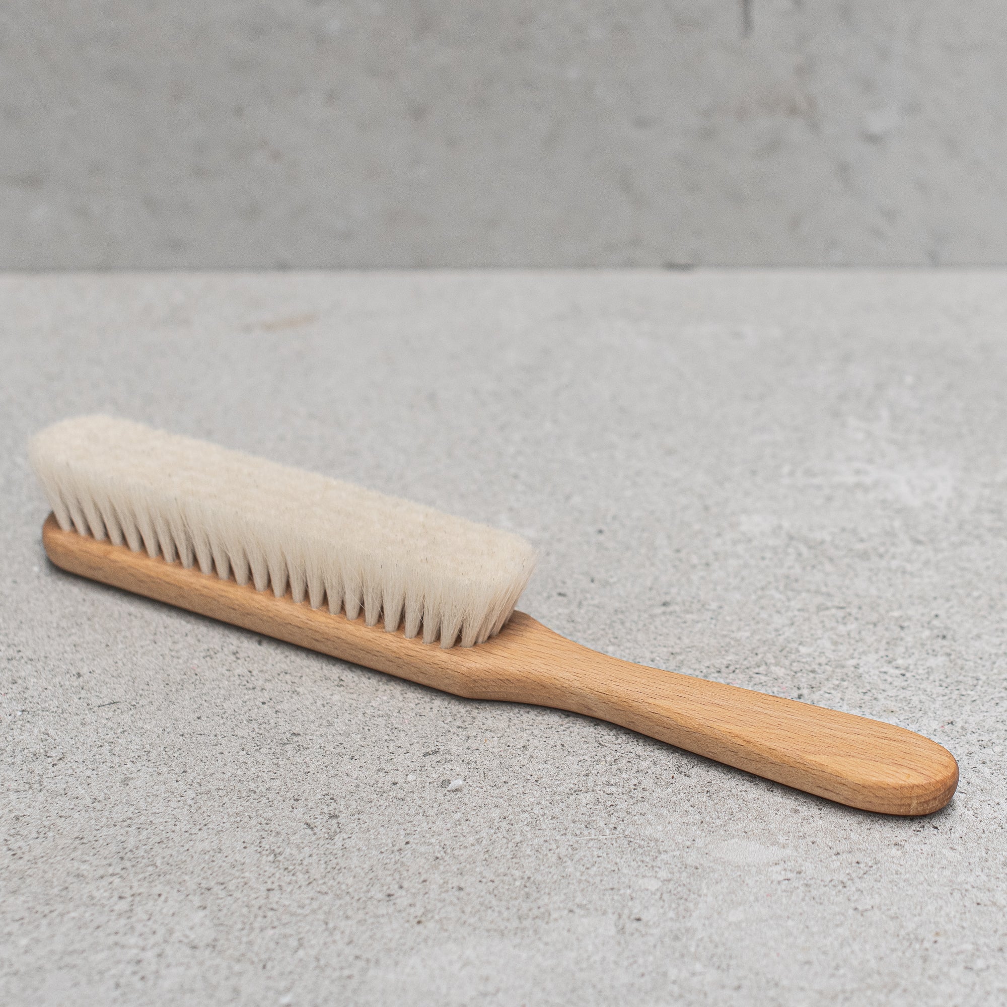 German-made wooden and goats hair dust brush by Kellerbürsten, featuring soft, natural bristles and a sturdy wooden handle, perfect for gently sweeping dust and debris from surfaces with precision and care. heaven in earth (HIE)