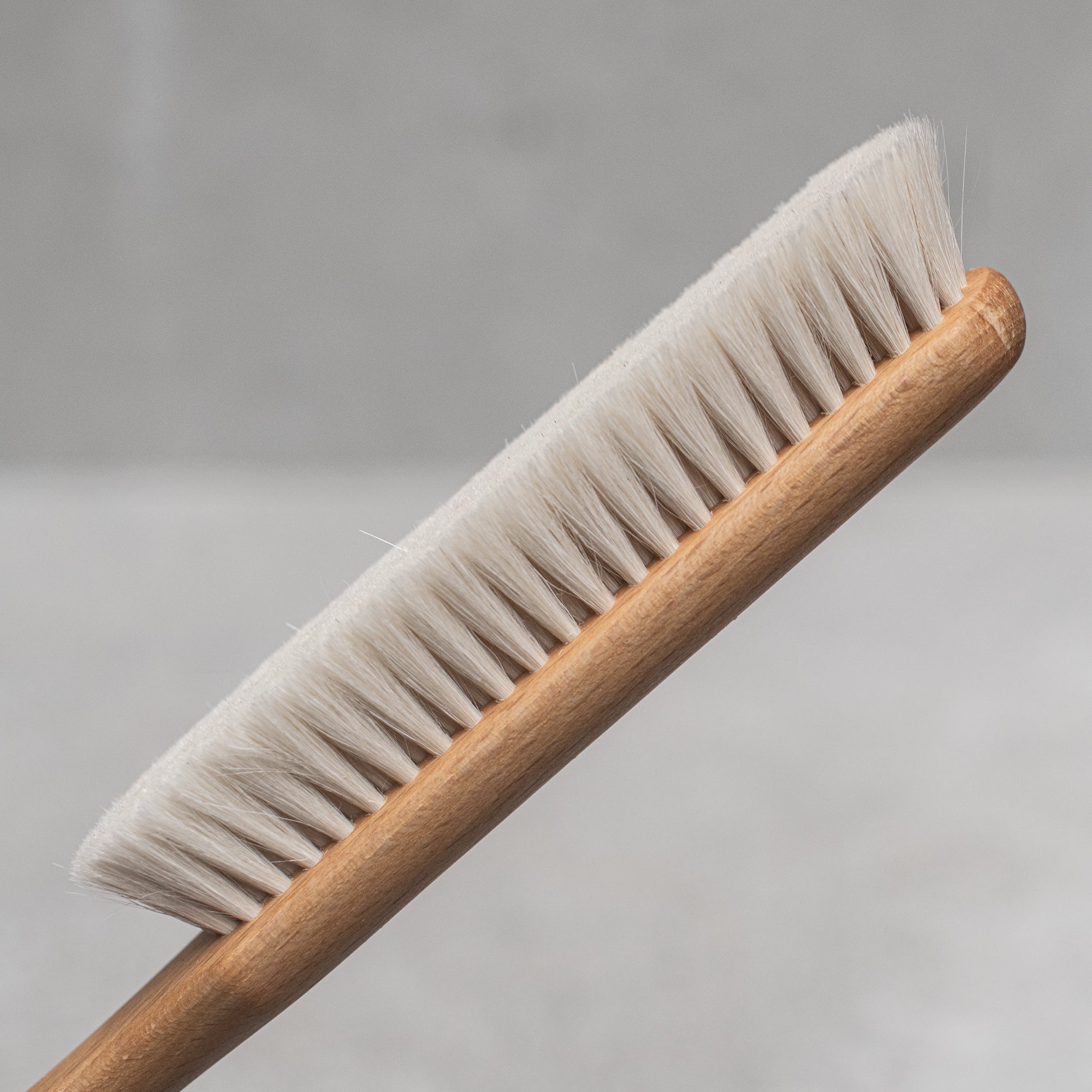 German-made wooden and goats hair dust brush by Kellerbürsten, featuring soft, natural bristles and a sturdy wooden handle, perfect for gently sweeping dust and debris from surfaces with precision and care. heaven in earth (HIE)