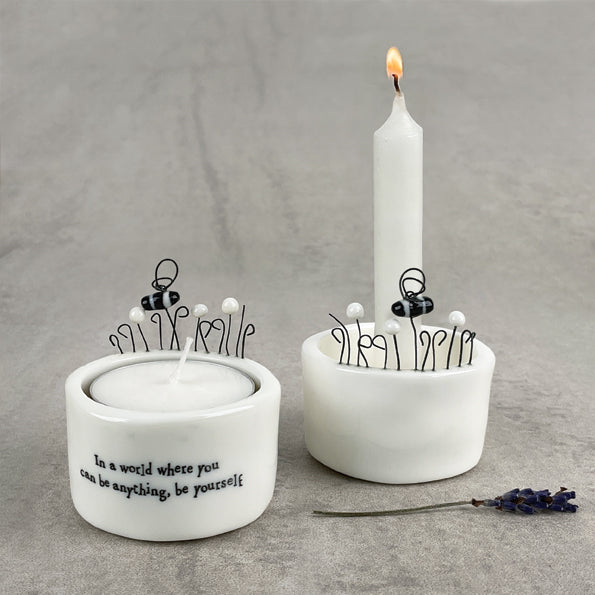 Porcelain candle holders by East of India, UK, featuring a minimalist design with delicate detailing, perfect for creating a warm, ambient glow in any room