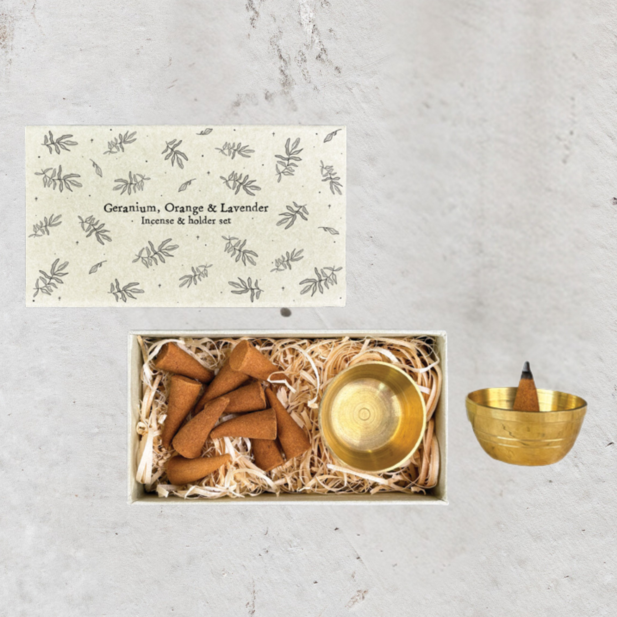 Geranium, Orange & Lavender: Geranium, orange and lavender incense cone gift set with ten cones and brass holder by East Of India.
