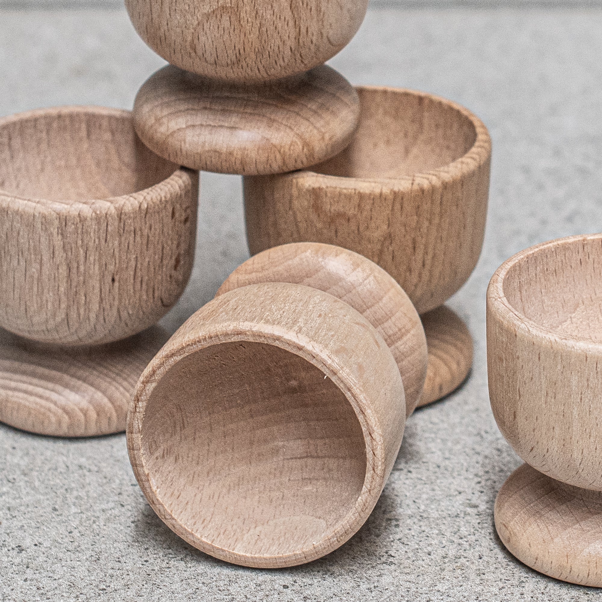 Heaven in Earth German-made wooden egg cup, crafted from high-quality wood with a smooth, natural finish, designed to hold your eggs in style for a simple, eco-friendly breakfast experience