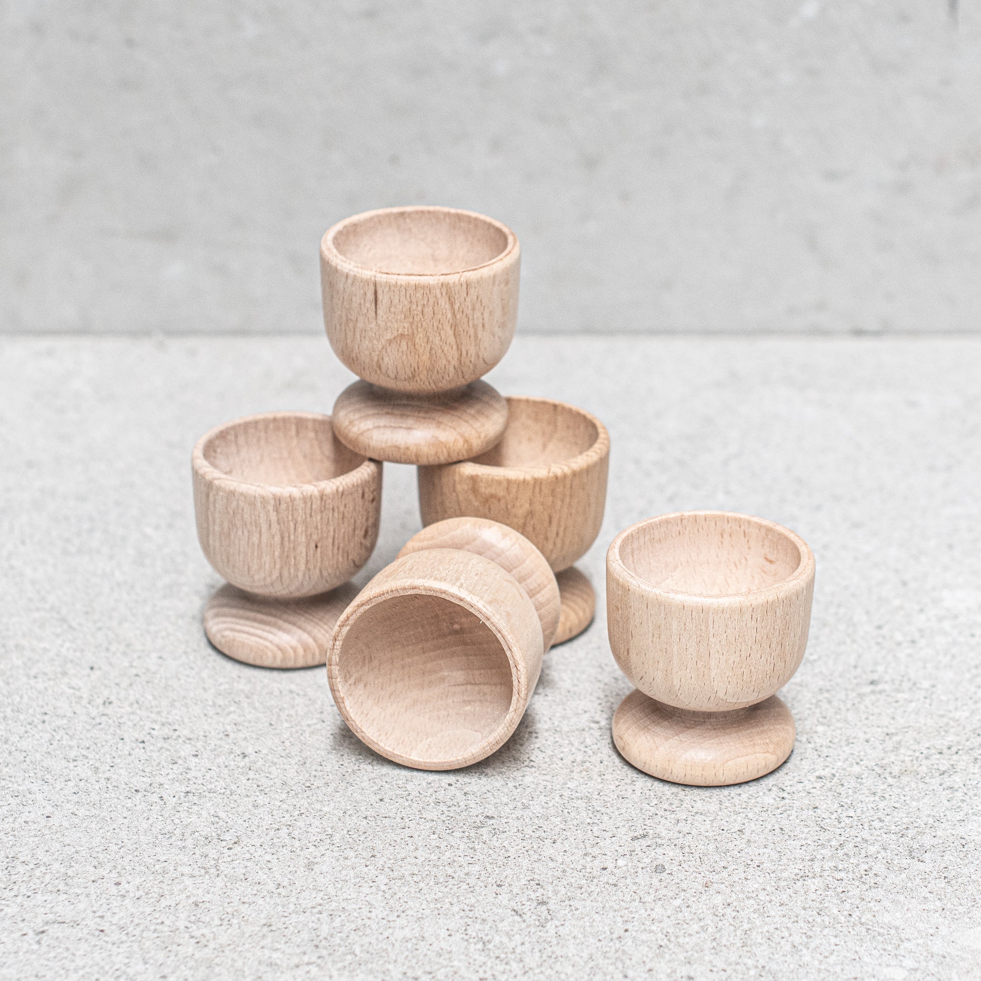 Heaven in Earth German-made wooden egg cup, crafted from high-quality wood with a smooth, natural finish, designed to hold your eggs in style for a simple, eco-friendly breakfast experience
