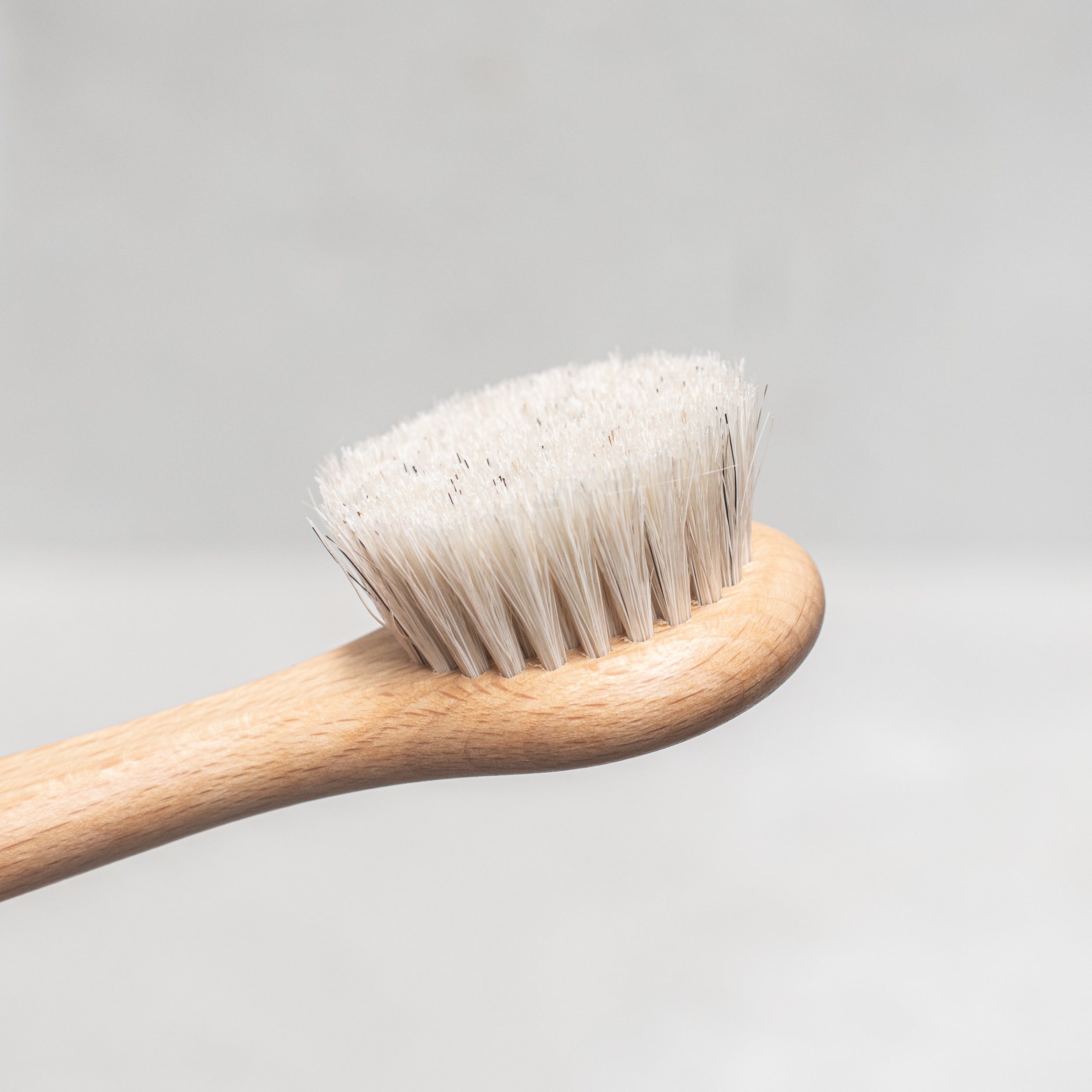 Heaven in Earth wooden and natural bristles face and body brush by Kellerbürsten, Germany, crafted with soft, eco-friendly bristles and a smooth wooden handle, designed for gentle exfoliation and effective skin care from head to toe