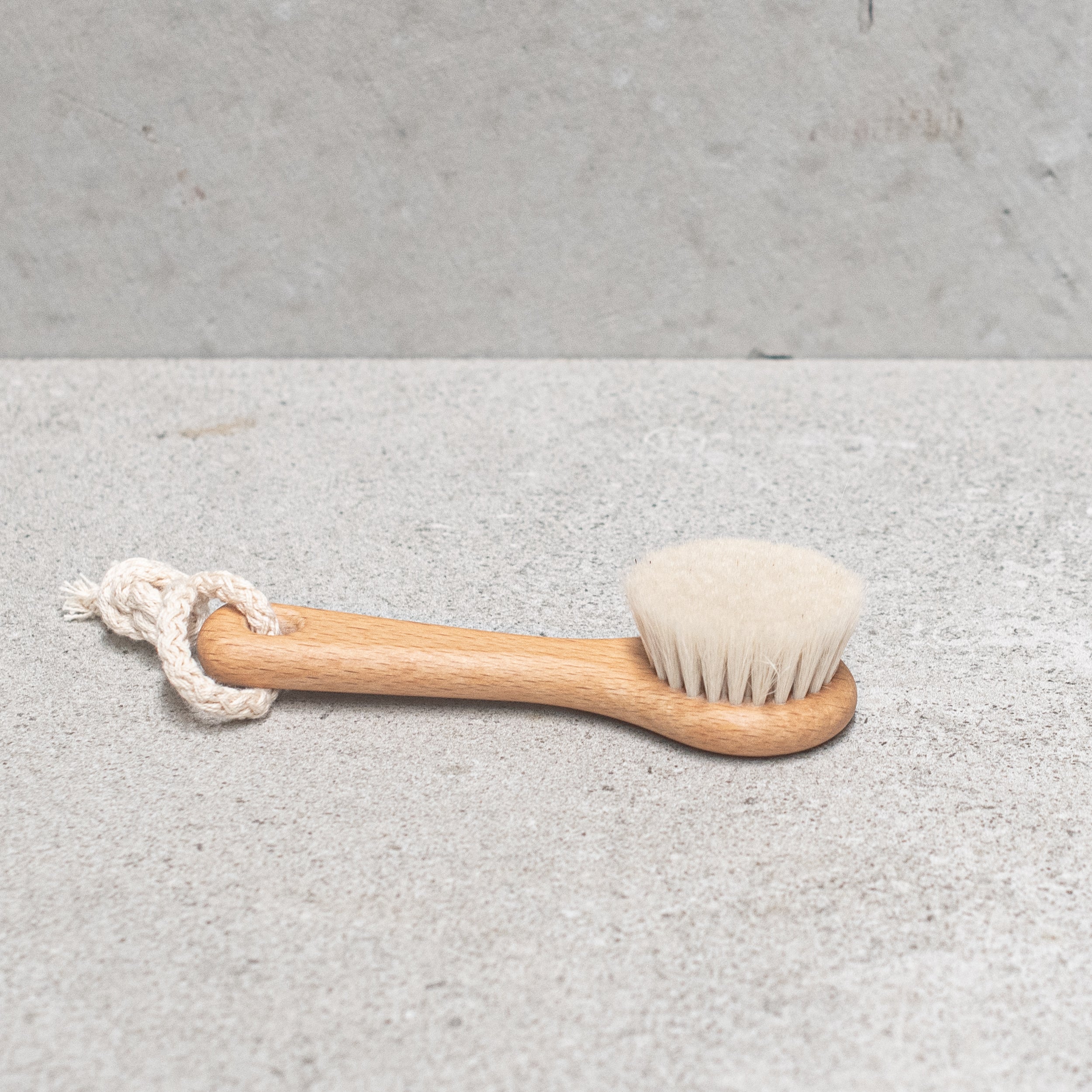 Heaven in Earth wooden and goats hair face brush by Kellerbürsten, Germany, featuring soft, gentle bristles and a smooth wooden handle, perfect for delicately cleansing and massaging the face with an eco-friendly touch
