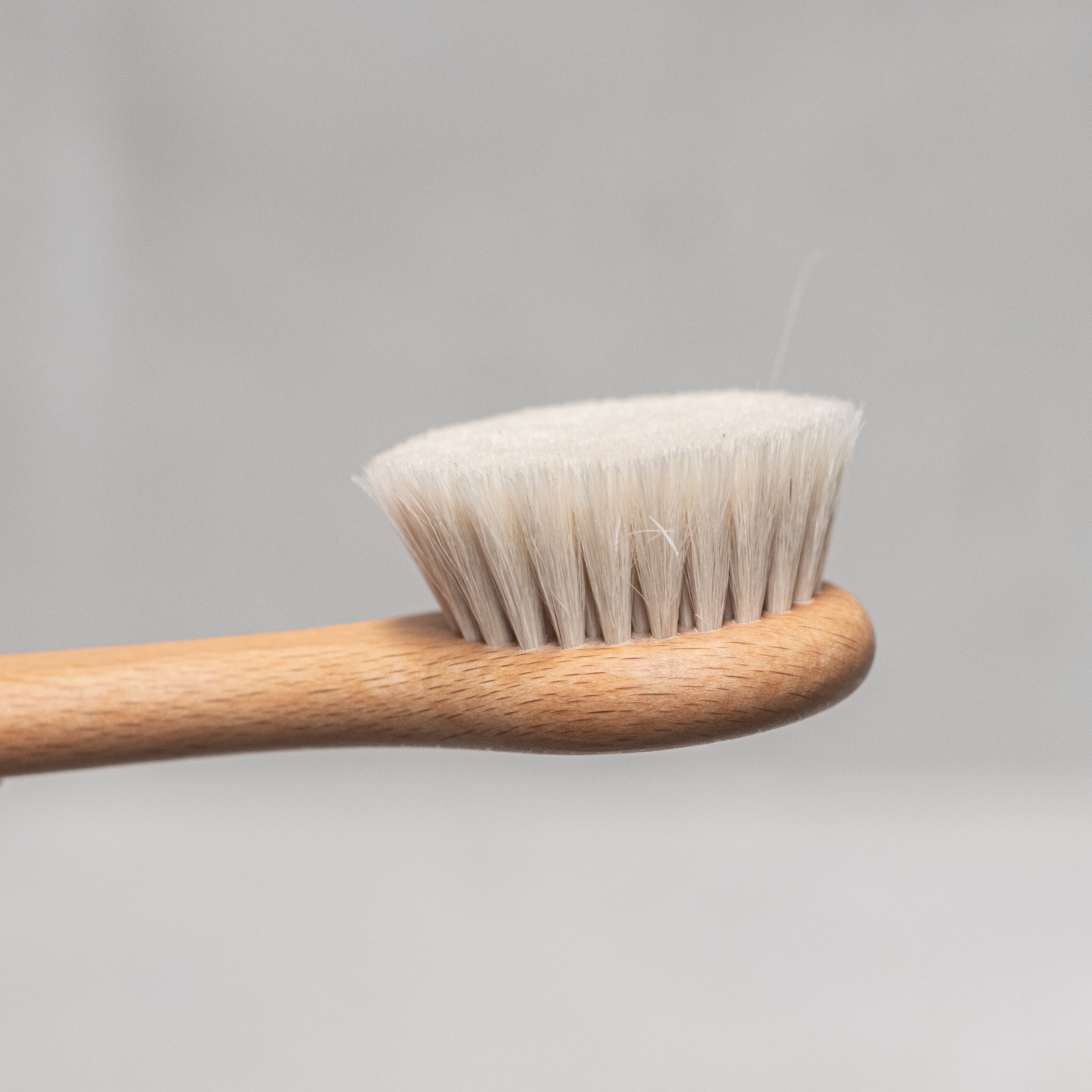 Heaven in Earth wooden and goats hair face brush by Kellerbürsten, Germany, featuring soft, gentle bristles and a smooth wooden handle, perfect for delicately cleansing and massaging the face with an eco-friendly touch