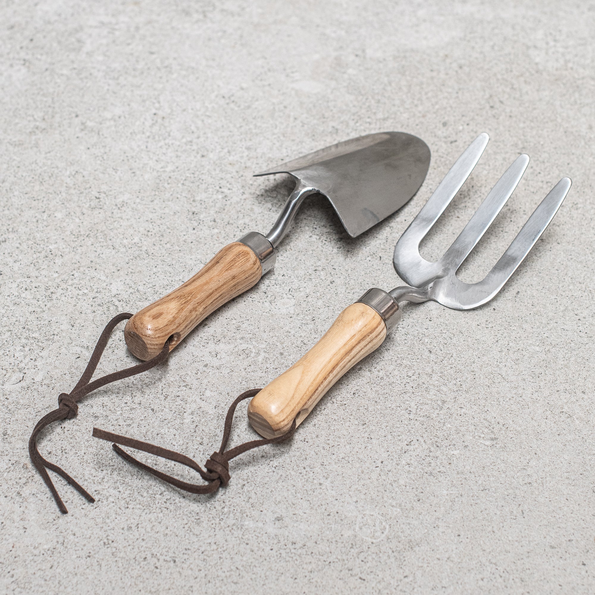 Children's stainless steel garden tool set, featuring durable, child-sized tools with sturdy wooden handles, perfect for little gardeners to dig, plant, and explore the outdoors
