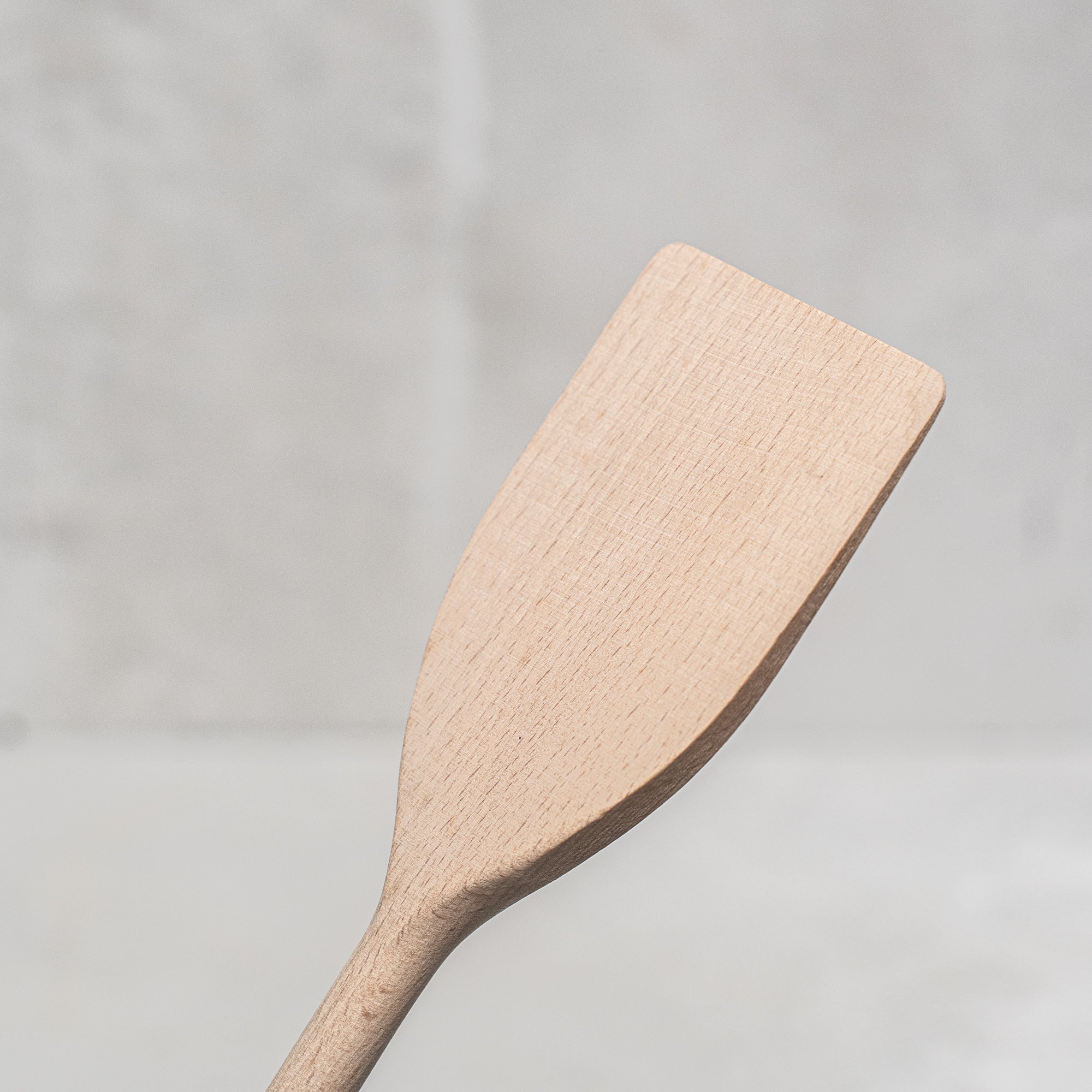 Heaven in Earth German-made wooden round handle spatula stirrer, crafted from high-quality, durable wood with a smooth finish. Ideal for stirring, mixing, and scraping in the kitchen, this eco-friendly tool offers a sleek, functional design that's gentle on cookware and perfect for everyday use