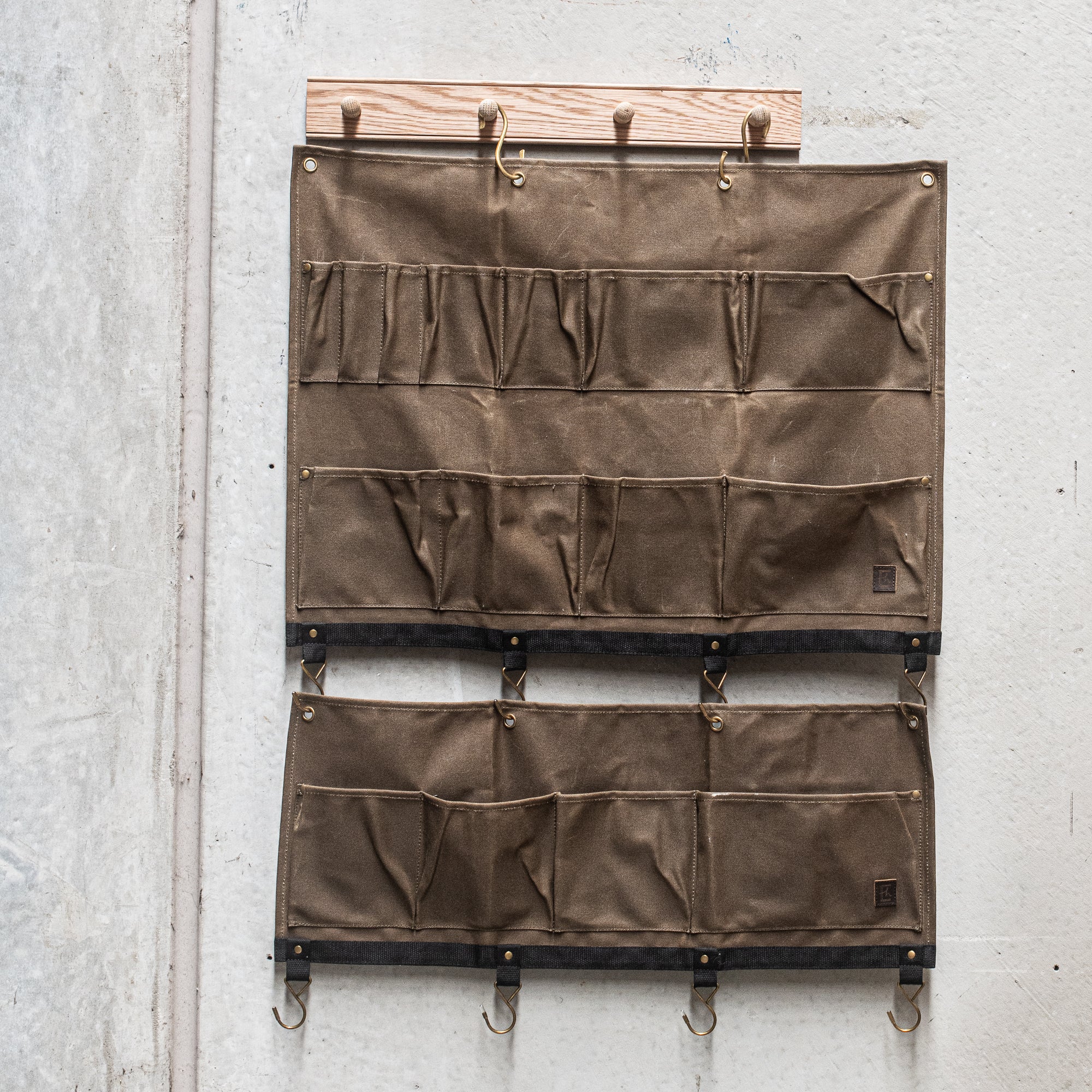 Durable Heaven in Earth waxed canvas hangers, designed for strength and style. Crafted from water-resistant waxed canvas, these hangers offer a sturdy, eco-friendly solution for all your organising needs combining functionality with a rugged, rustic aesthetic.