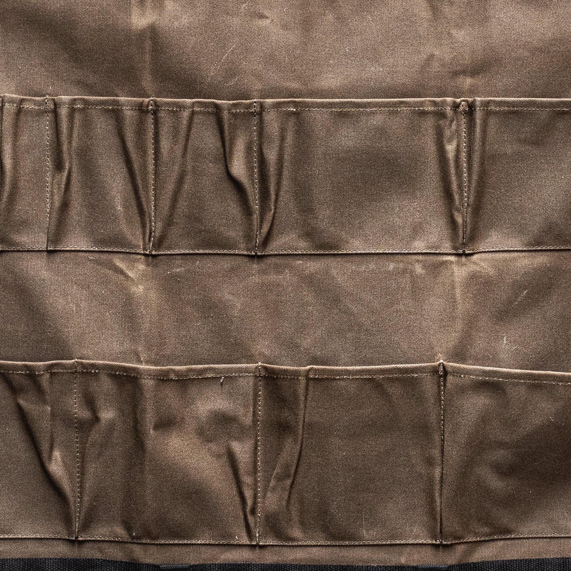 Durable Heaven in Earth waxed canvas hangers, designed for strength and style. Crafted from water-resistant waxed canvas, these hangers offer a sturdy, eco-friendly solution for all your organising needs combining functionality with a rugged, rustic aesthetic.