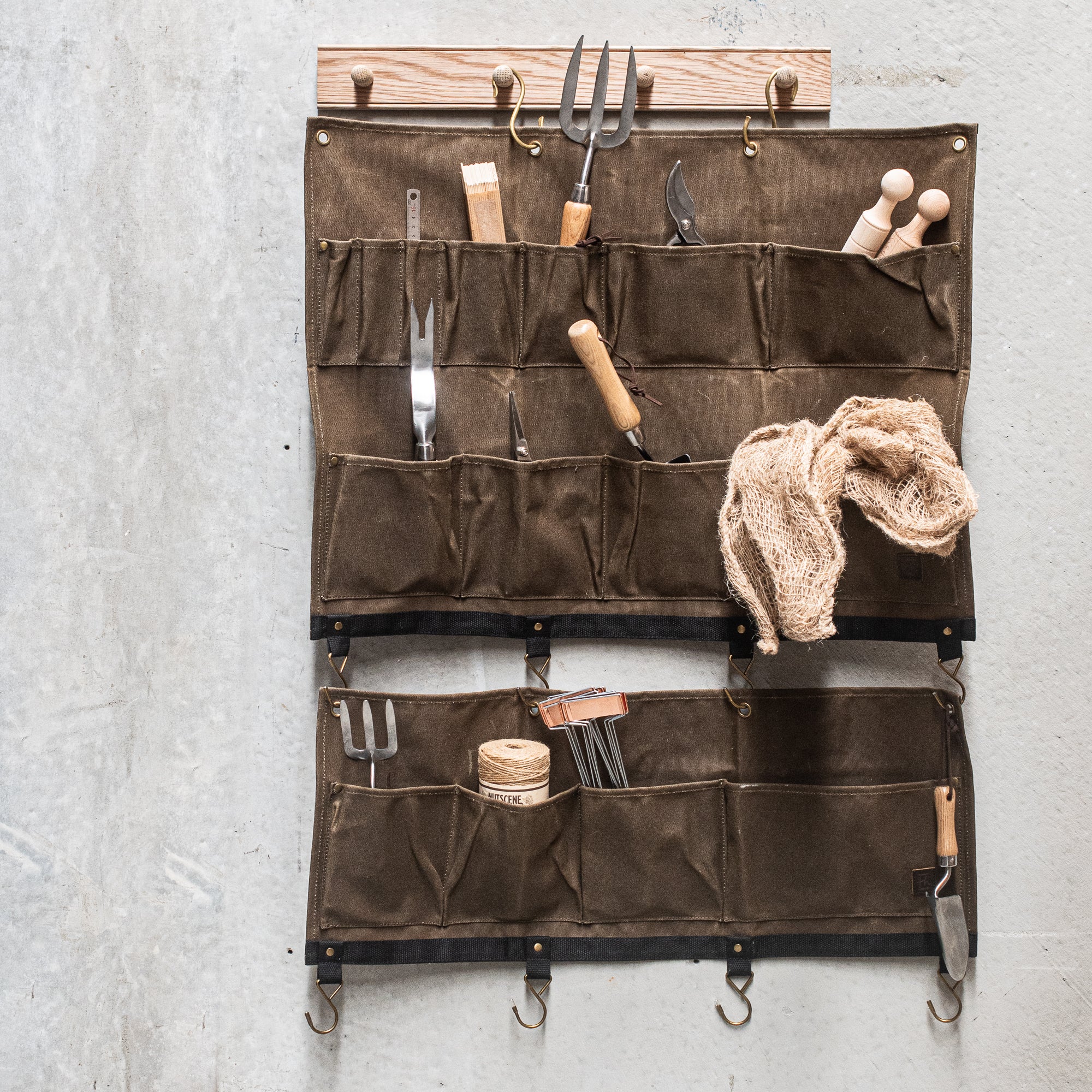 Durable Heaven in Earth waxed canvas hangers, designed for strength and style. Crafted from water-resistant waxed canvas, these hangers offer a sturdy, eco-friendly solution for all your organising needs combining functionality with a rugged, rustic aesthetic.