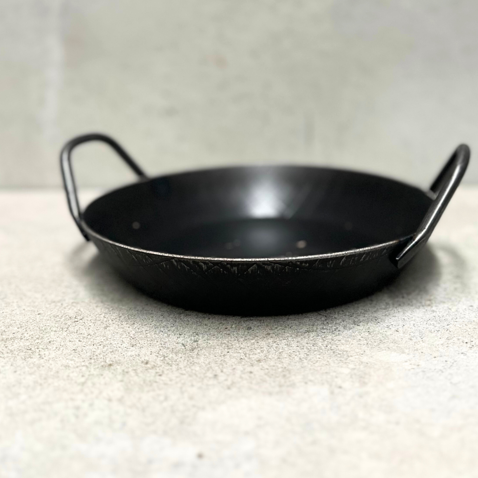Forged iron pan with 2 grip handles
