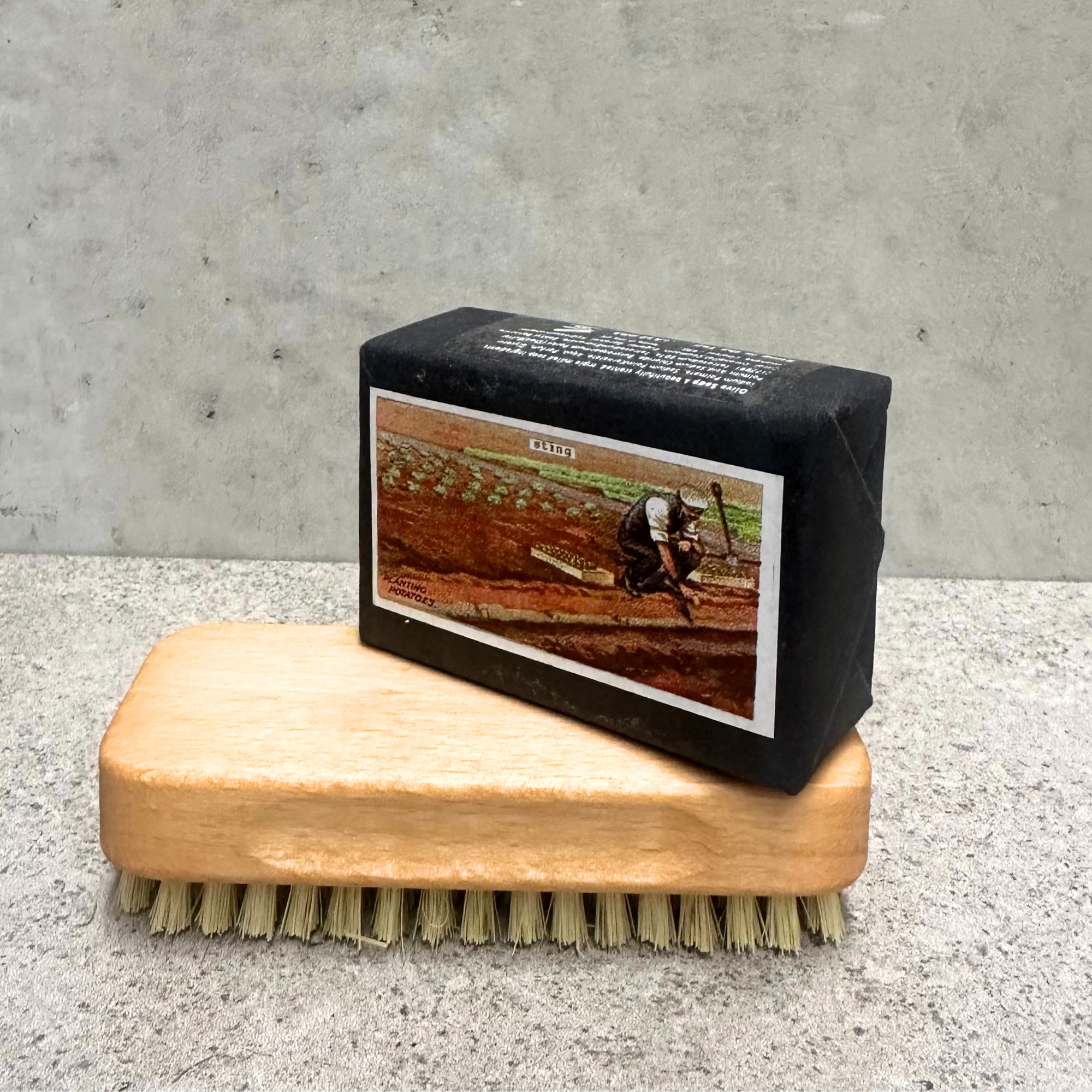 Heaven in Earth (HIE) delightful gardener's triple-milled olive soap, hand-packaged with charming images of various potted plants on the front and a planting description on the back. Made by Sting in the Tail, UK, this soap is gentle on the skin and perfect for gardeners, leaving hands soft and clean after a day in the soil