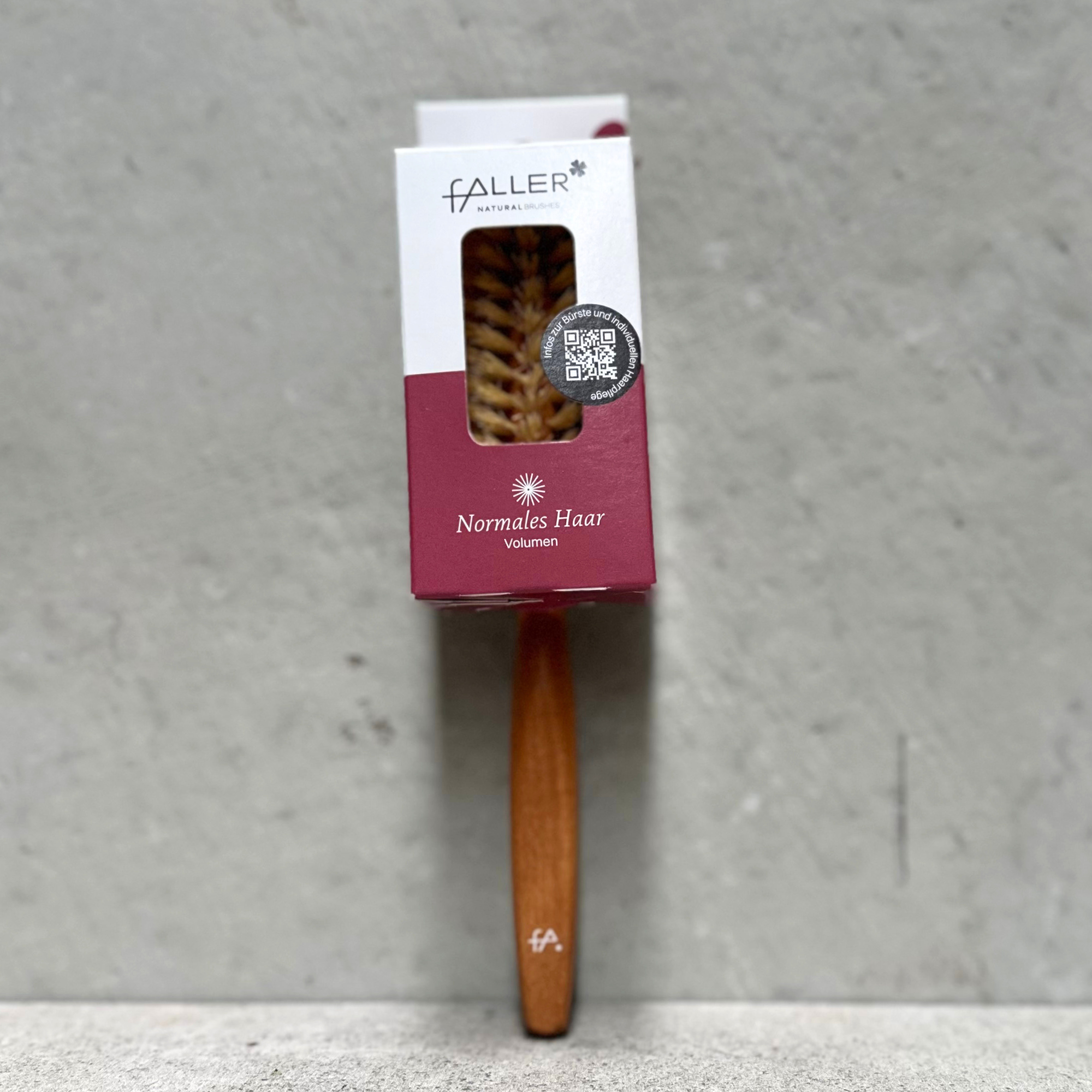 Half round vegan hair brush with beechwood handle and vegan fibre bristles by Faller Germany.