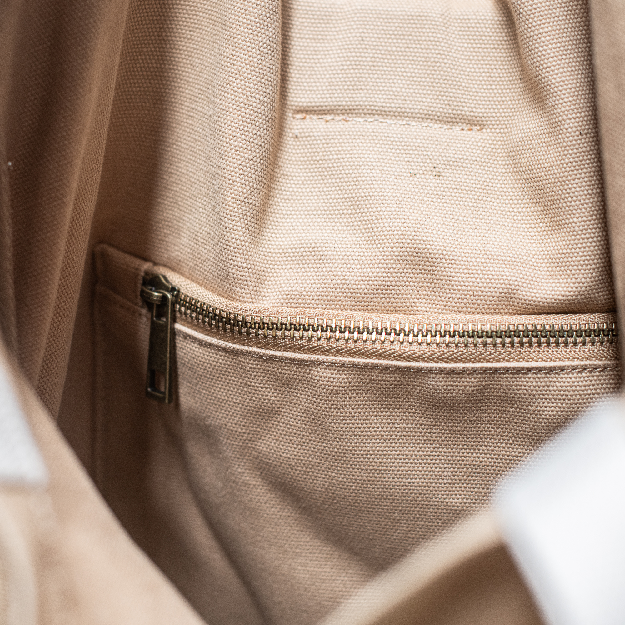 Heaven in Earth carry-all canvas backpack, featuring a spacious design with sturdy straps and a stylish, versatile look, perfect for everyday use or weekend adventures.