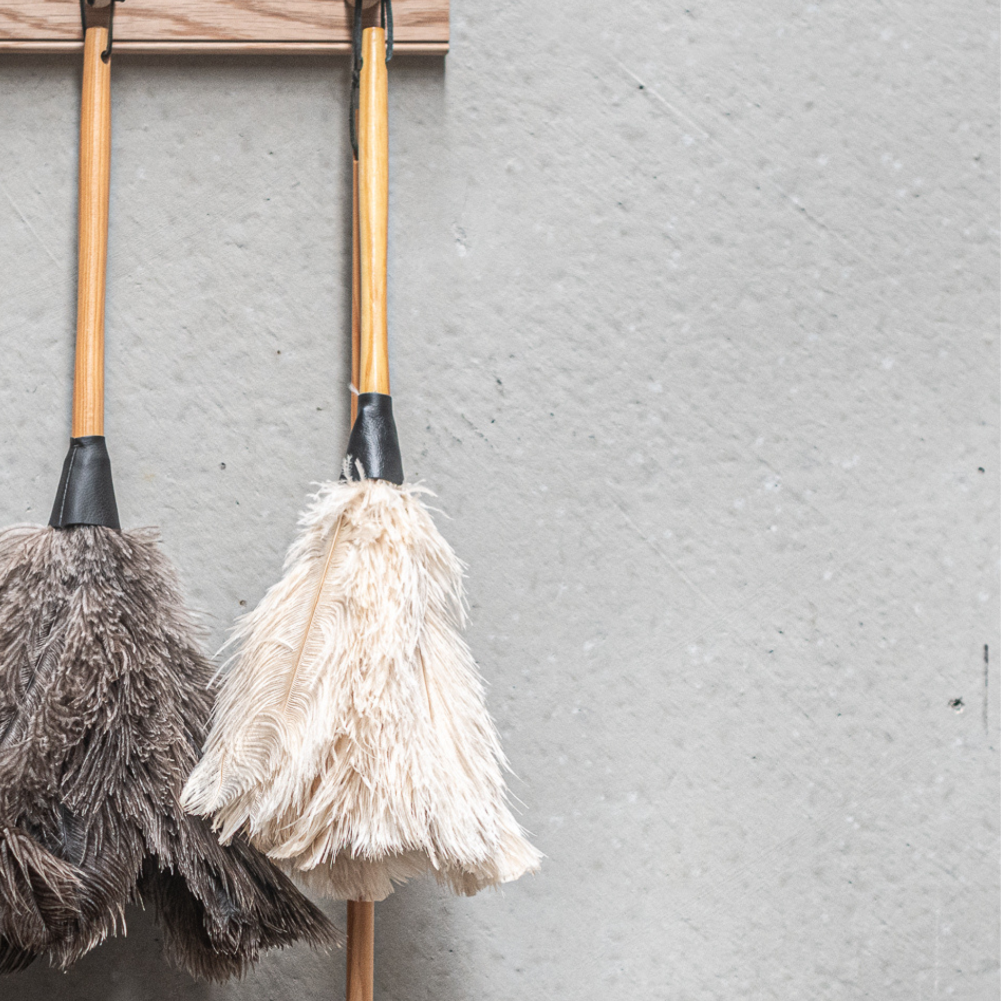 South African-made ostrich feather duster by Heaven in Earth (HIE), featuring soft, natural ostrich feathers that attract dust without spreading it. The lightweight wooden handle makes it easy to use, offering an elegant, eco-friendly solution for gentle, effective cleaning