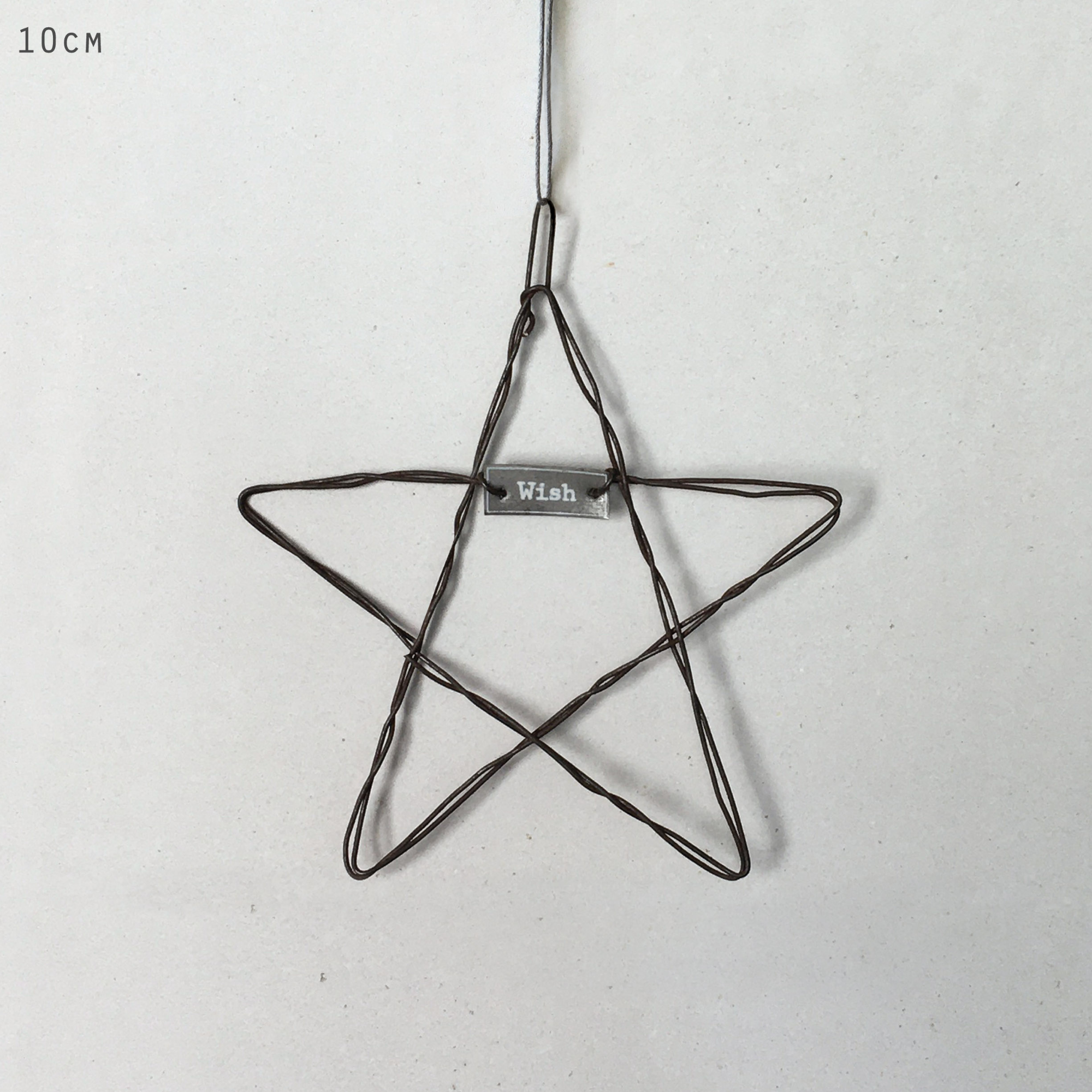 Rustic wire star Christmas decoration with Wish metal tag by East of India.