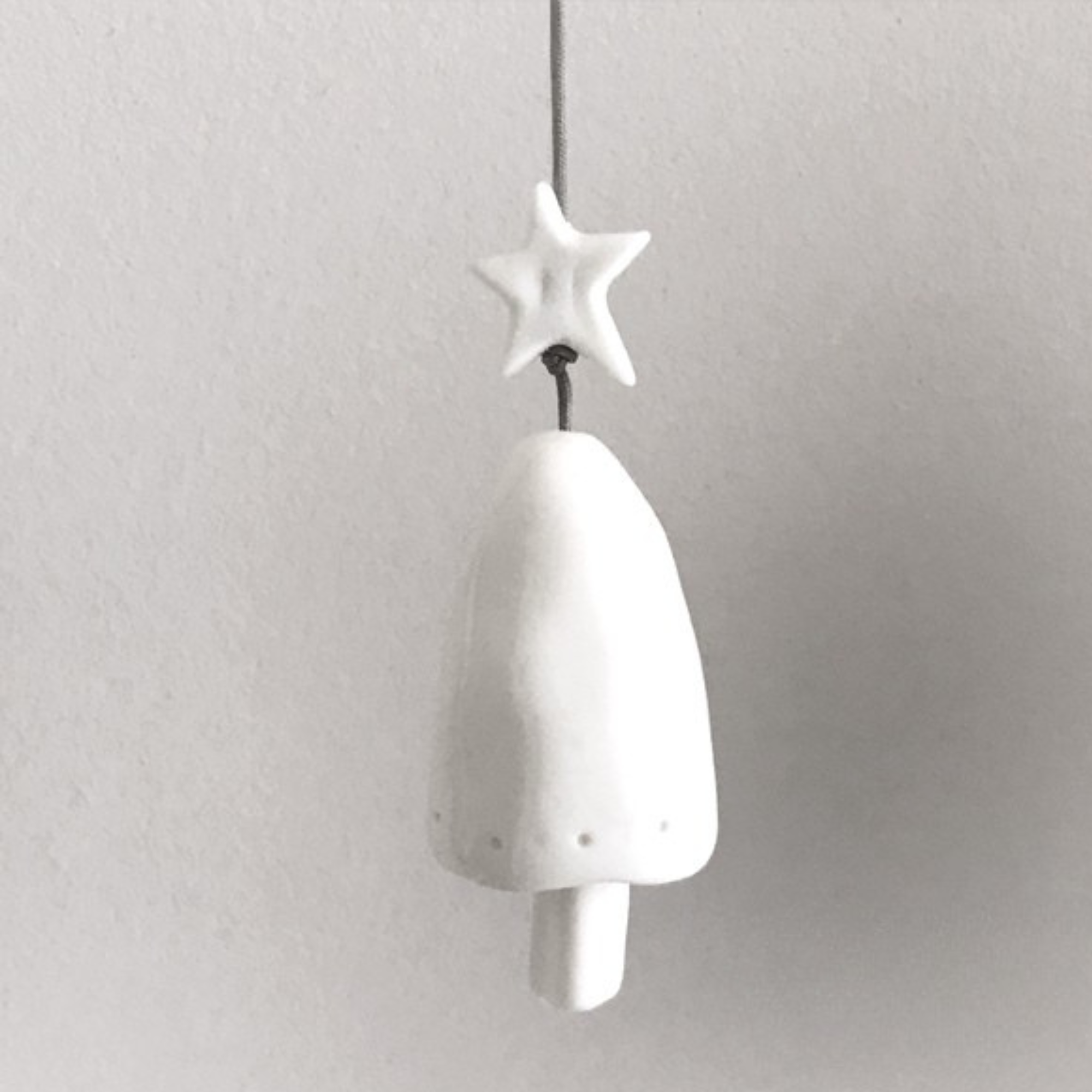 Porcelain hanging Christmas decoration in festive design
