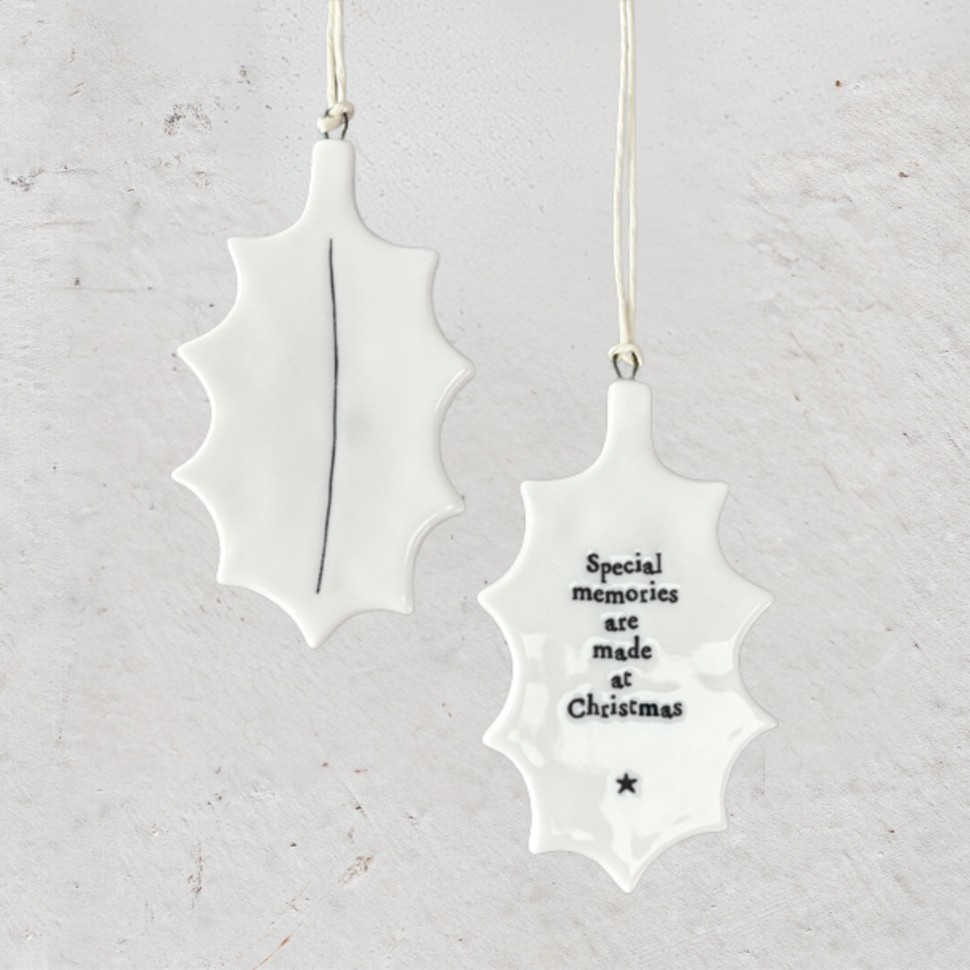 The Heaven In Earth's (HIE) Porcelain Holly Hanger from East of India truly embodies the spirit of the season. Its beautiful design not only captures the essence of Christmas with its holly motif but also features a heartfelt sentiment on one side, making it a special keepsake. This decoration serves as a lovely reminder of the warmth and joy that the holiday season brings.