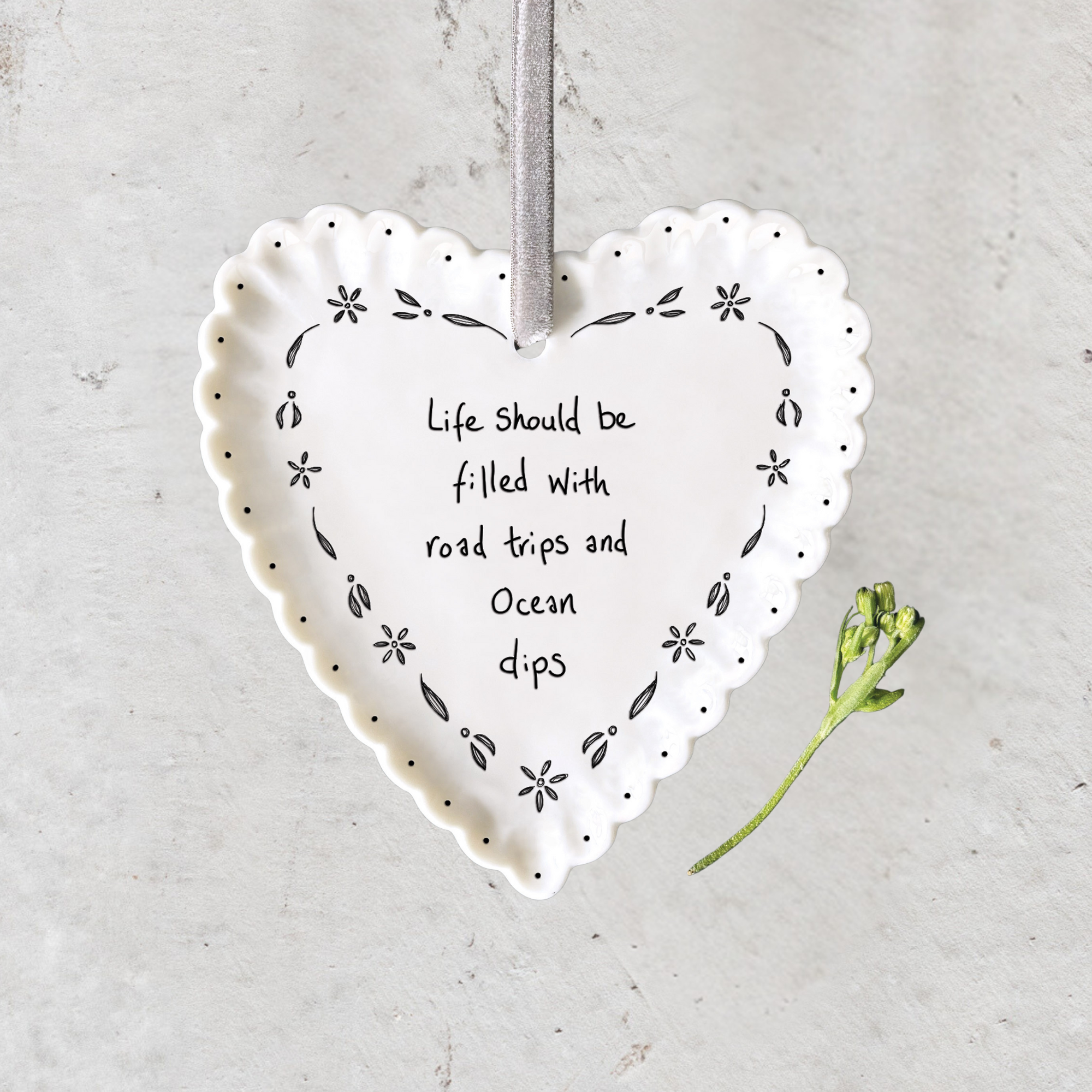 Handmade white porcelain heart hanger with scalloped edge, velvet ribbon and heartfelt sentiment by East of India.