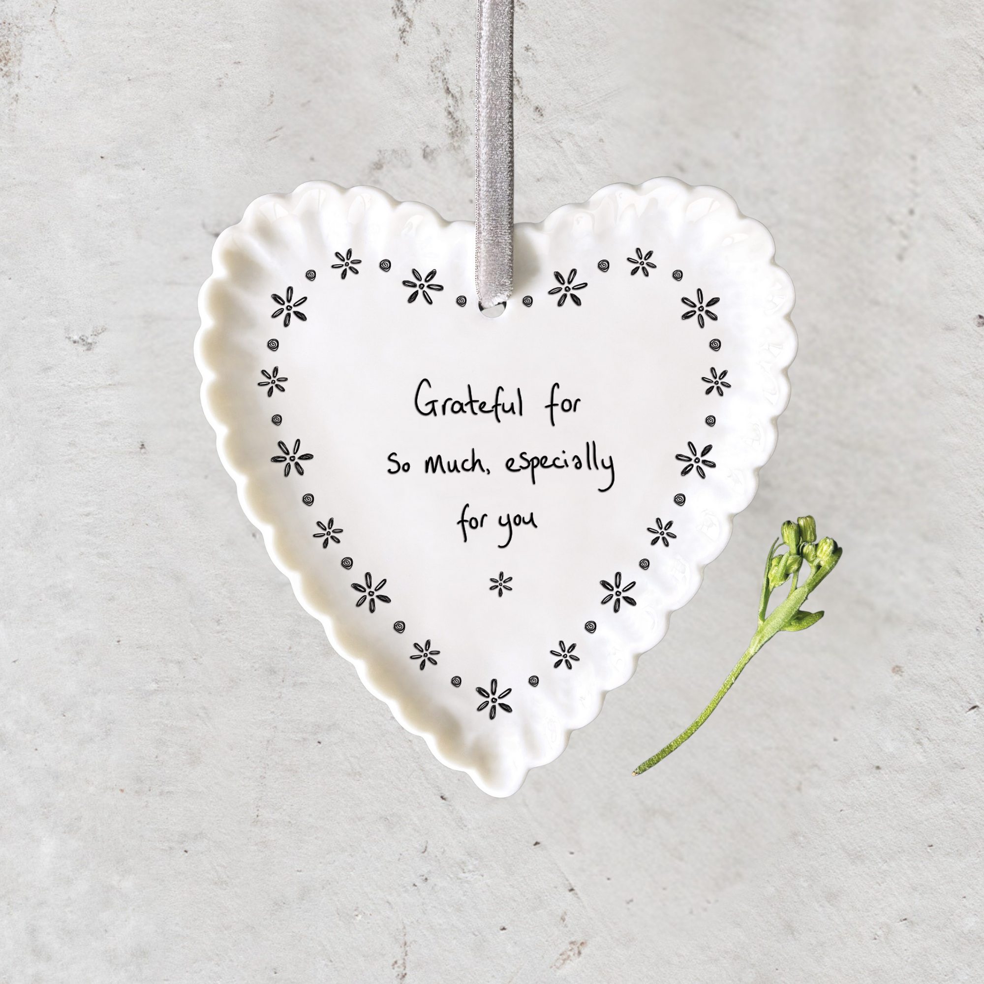 Handmade white porcelain heart hanger with scalloped edge, velvet ribbon and heartfelt sentiment by East of India.