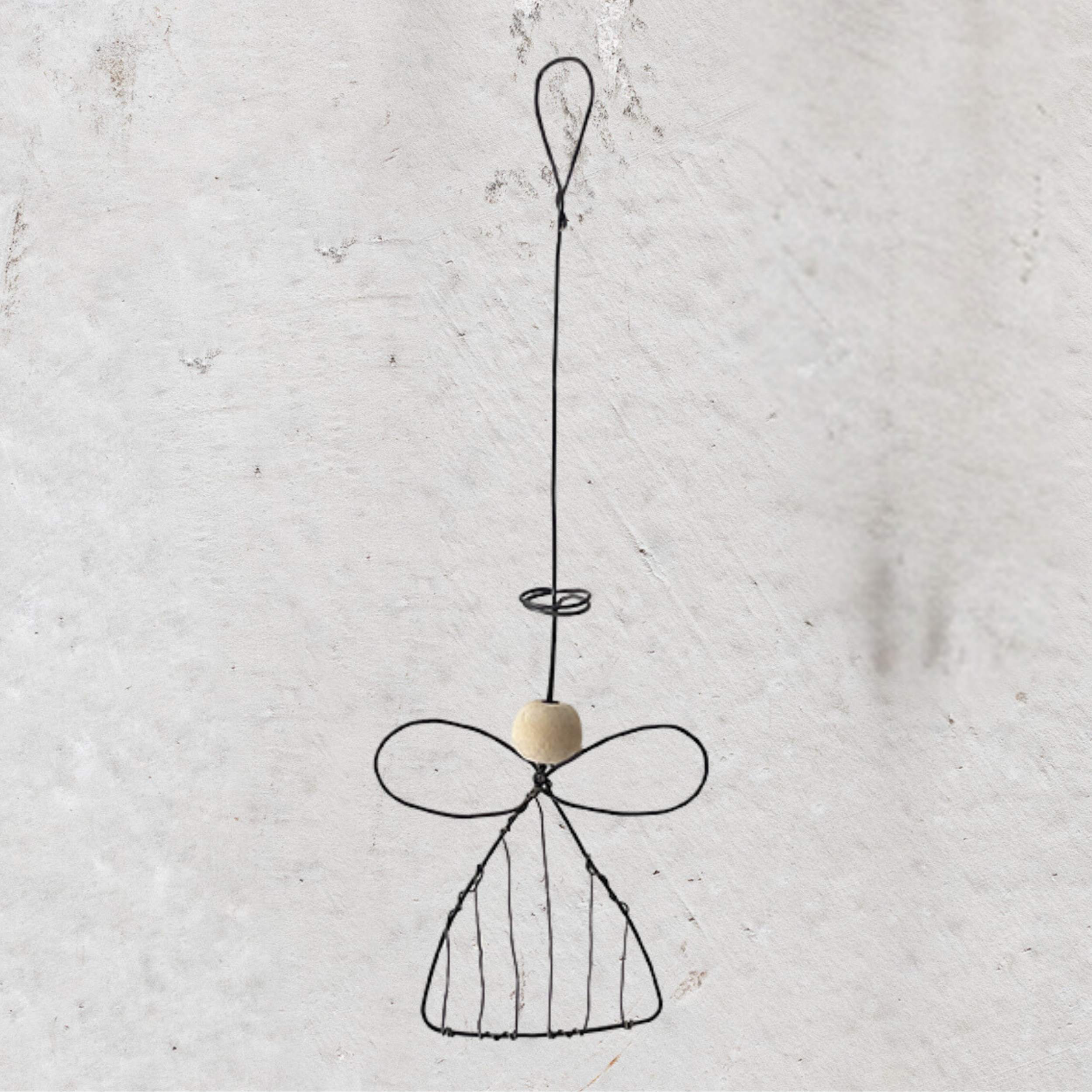 ast of India wire angel by Heaven in Earth (HIE), a beautifully crafted ornament featuring delicate wirework and a simple, elegant design. Perfect for adding a touch of charm and warmth to your home, this angel makes a lovely decoration for the holiday season or as a year-round symbol of peace.