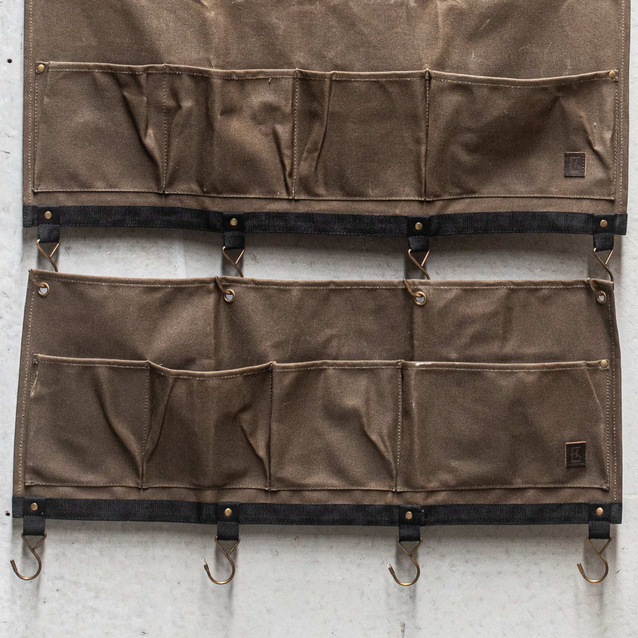 Durable Heaven in Earth waxed canvas hangers, designed for strength and style. Crafted from water-resistant waxed canvas, these hangers offer a sturdy, eco-friendly solution for all your organising needs combining functionality with a rugged, rustic aesthetic.