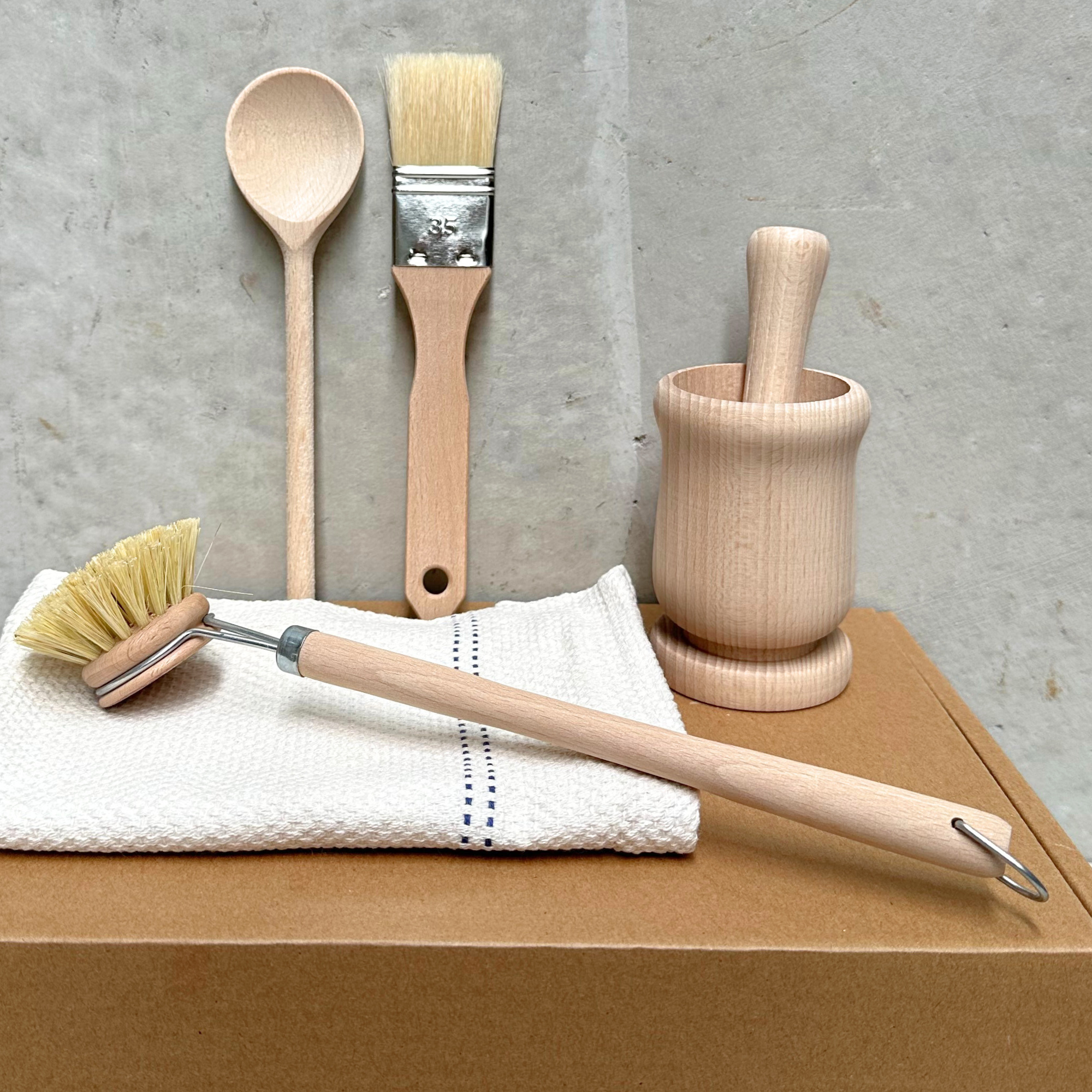 Heaven in Earth cook’s gift box ($50), featuring a set of essentials for the kitchen: a wooden spoon, dish brush, pastry brush, and a classic mortar and pestle. Perfect for cooking enthusiasts who appreciate natural, sustainable tools.